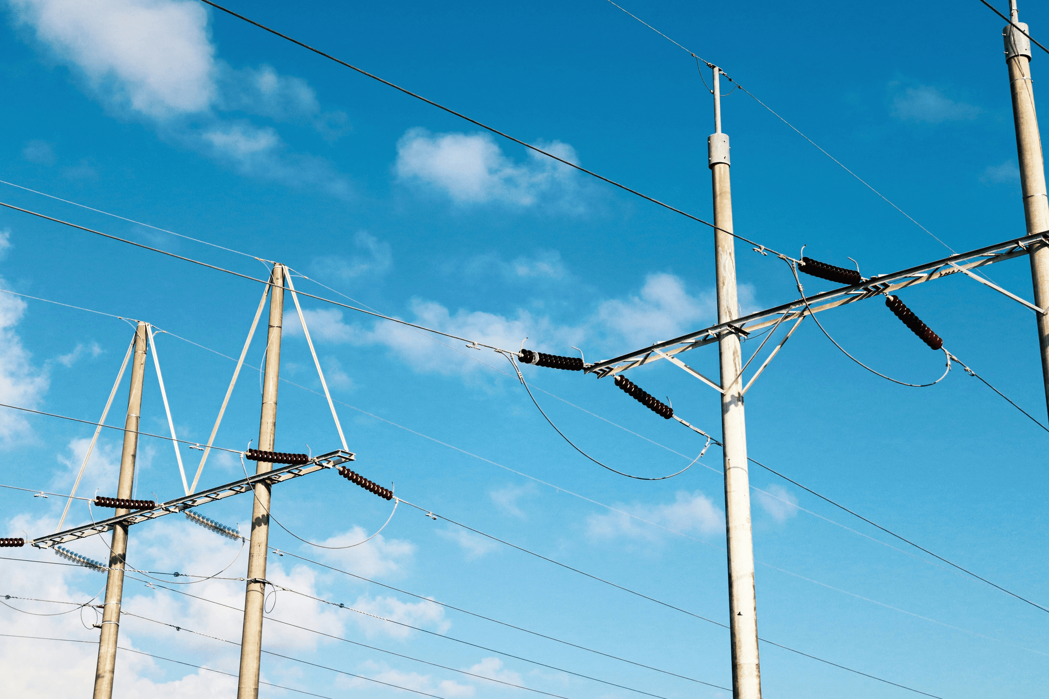 Different types of overhead transmission lines showcasing their structures.