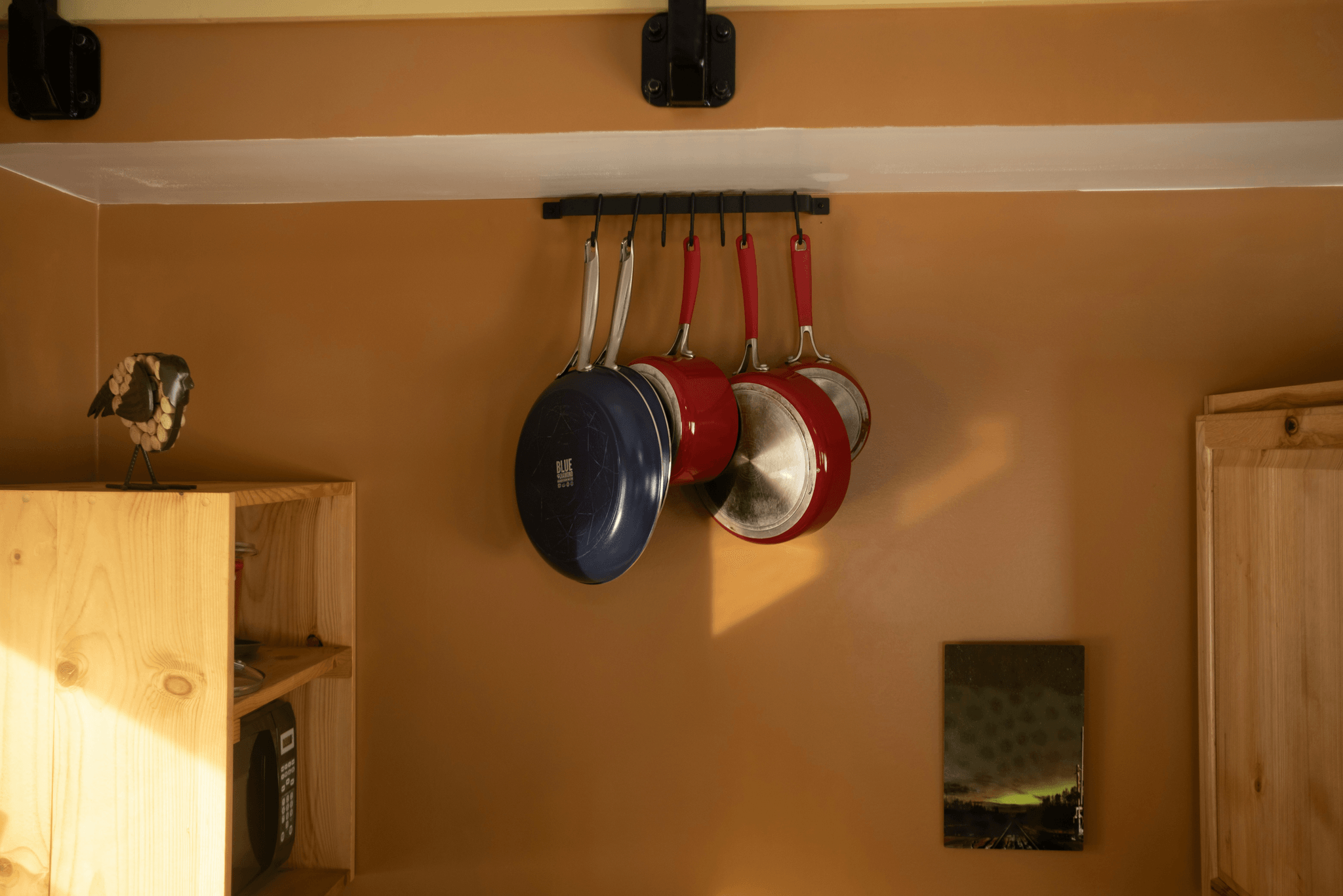 Maximizing Vertical Space with Hooks and Racks in Upper Corner Kitchen Cabinet