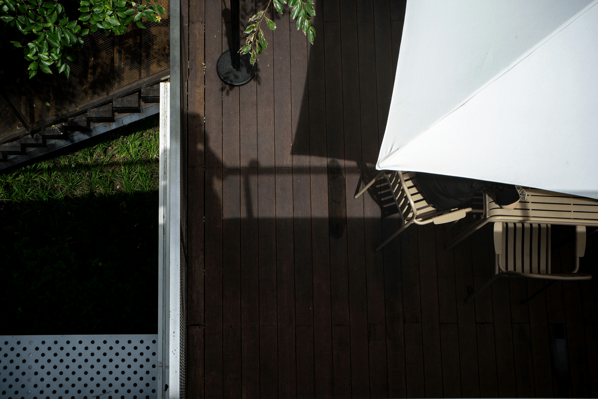 Protective awning over an artificial wood deck