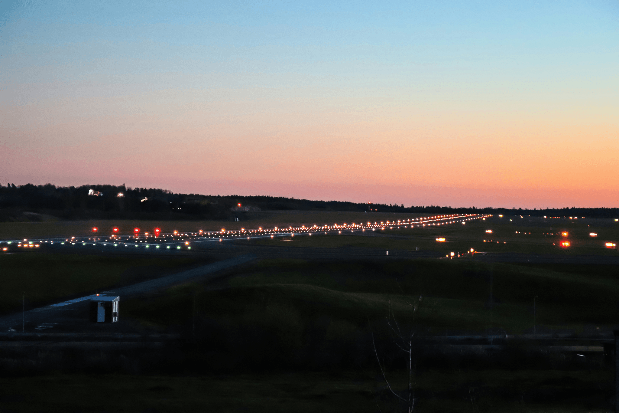 Illuminated approach lights ensuring safe runway aviation landings.