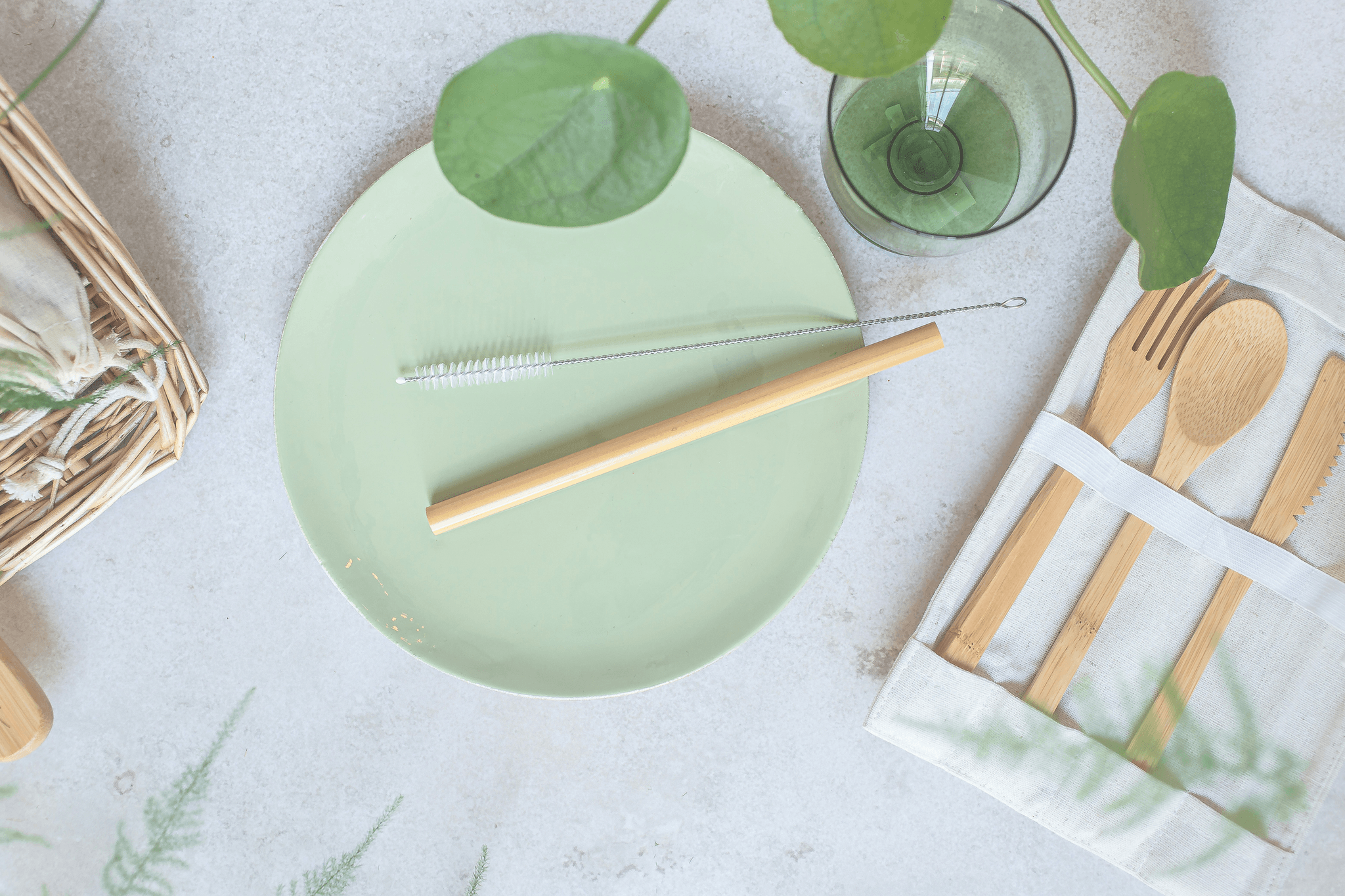 Stylish bamboo disposable eating utensils on a wooden table.