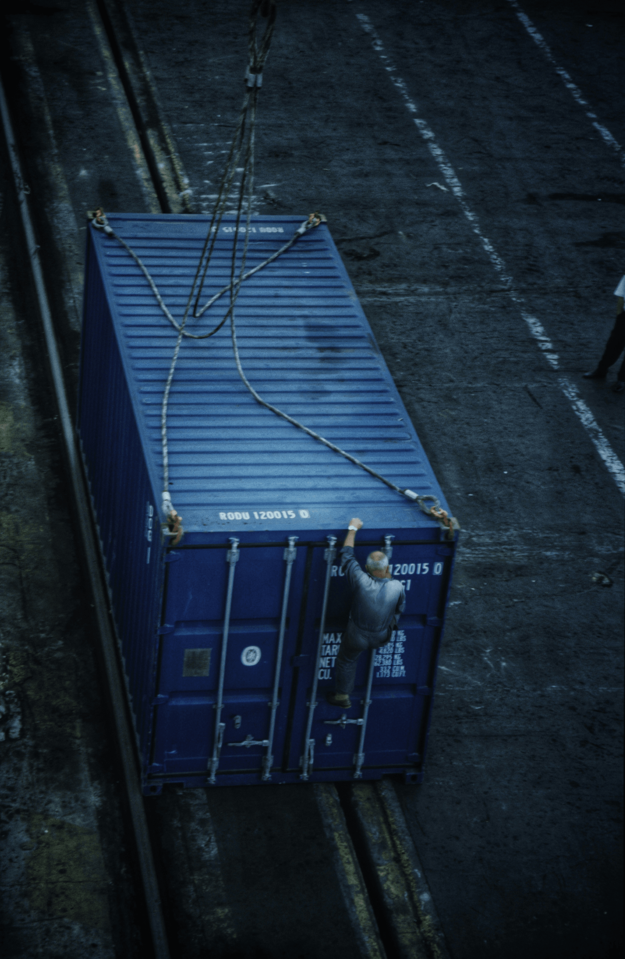FCA Terms: Freight container being loaded onto a cargo ship