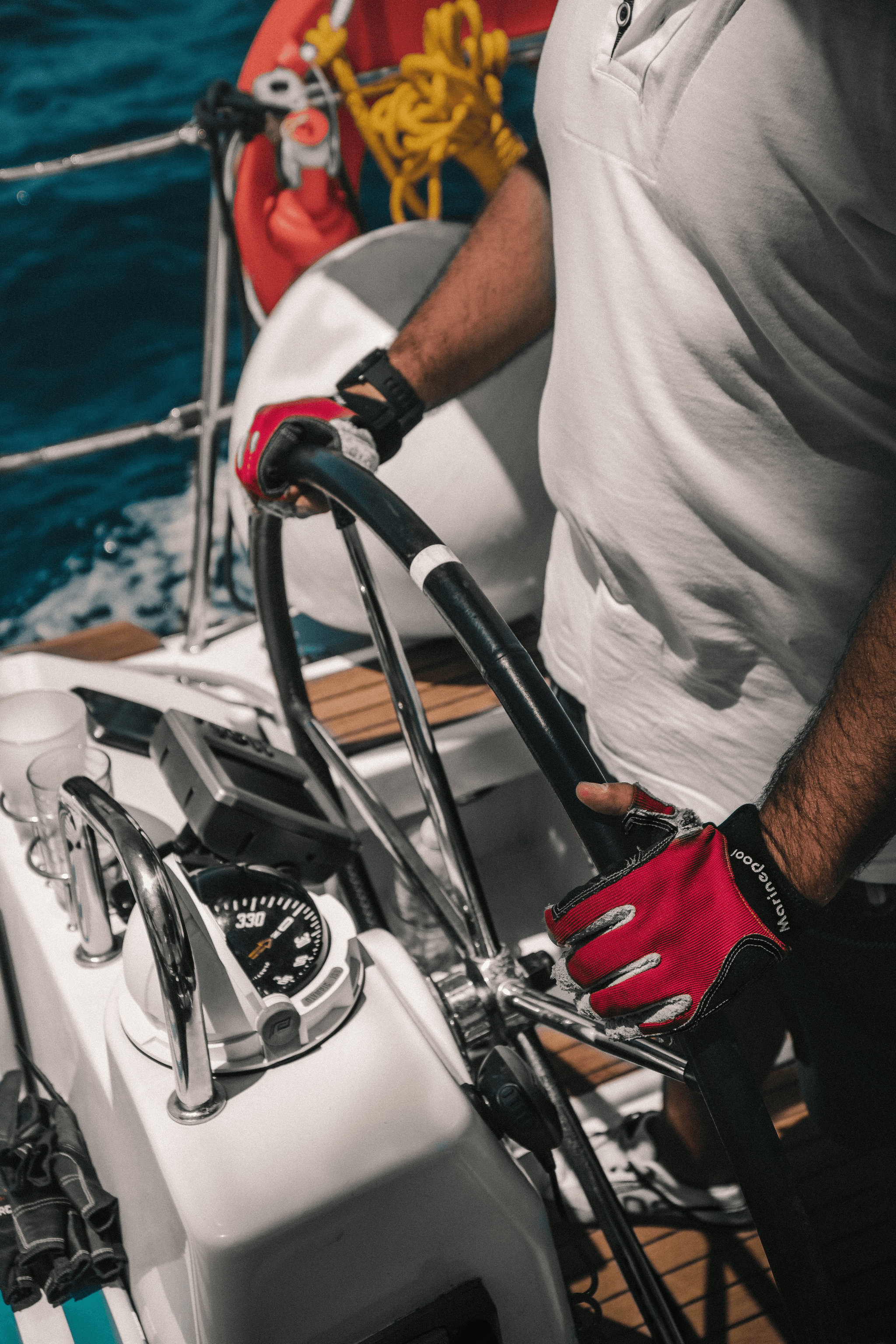 Expert technician inspecting steering cables on a small aluminum boat
