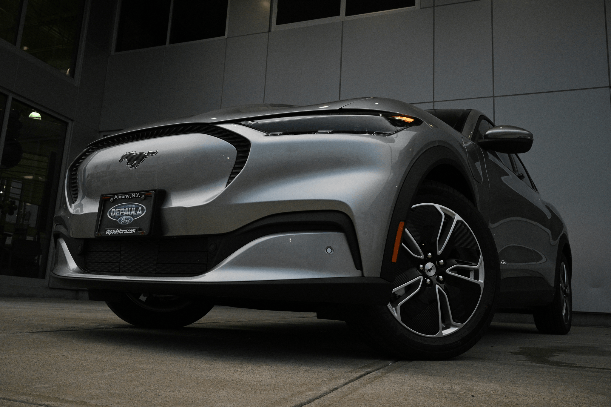 manufacturers of electric cars - Mustang Mach-E at charging station