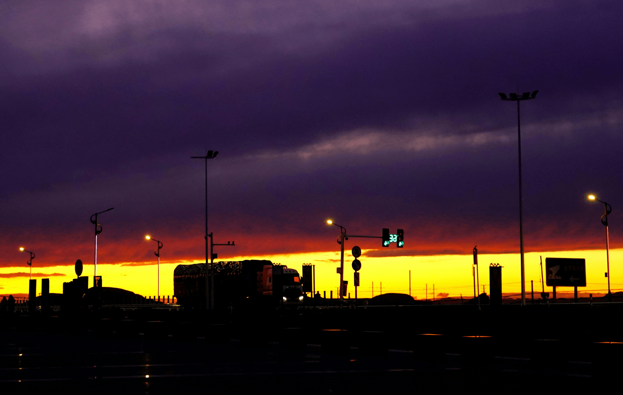 Various aircraft refuelers at airport ready for service.