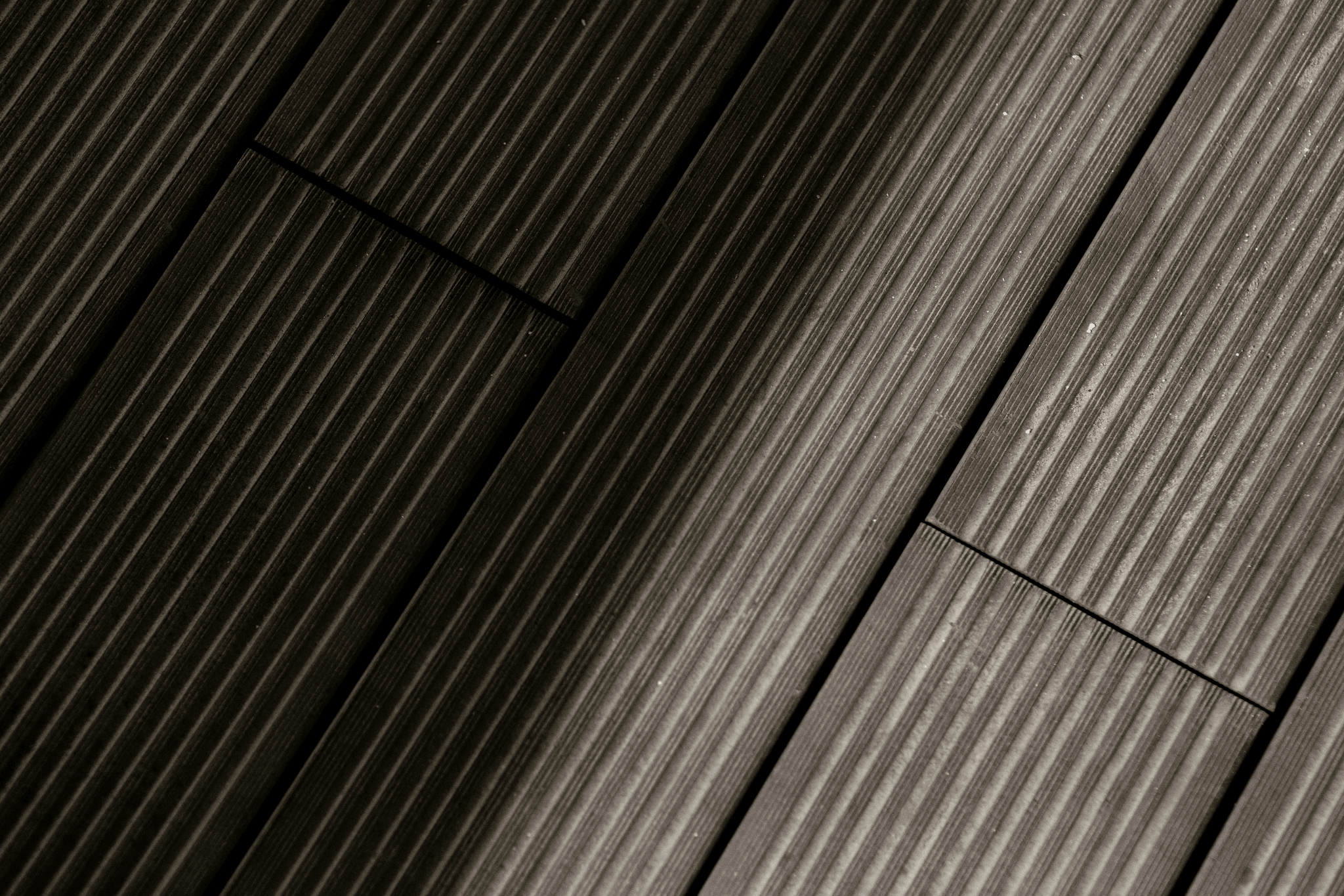 Comparison of Rigid Core Vinyl vs SPC showcasing textures