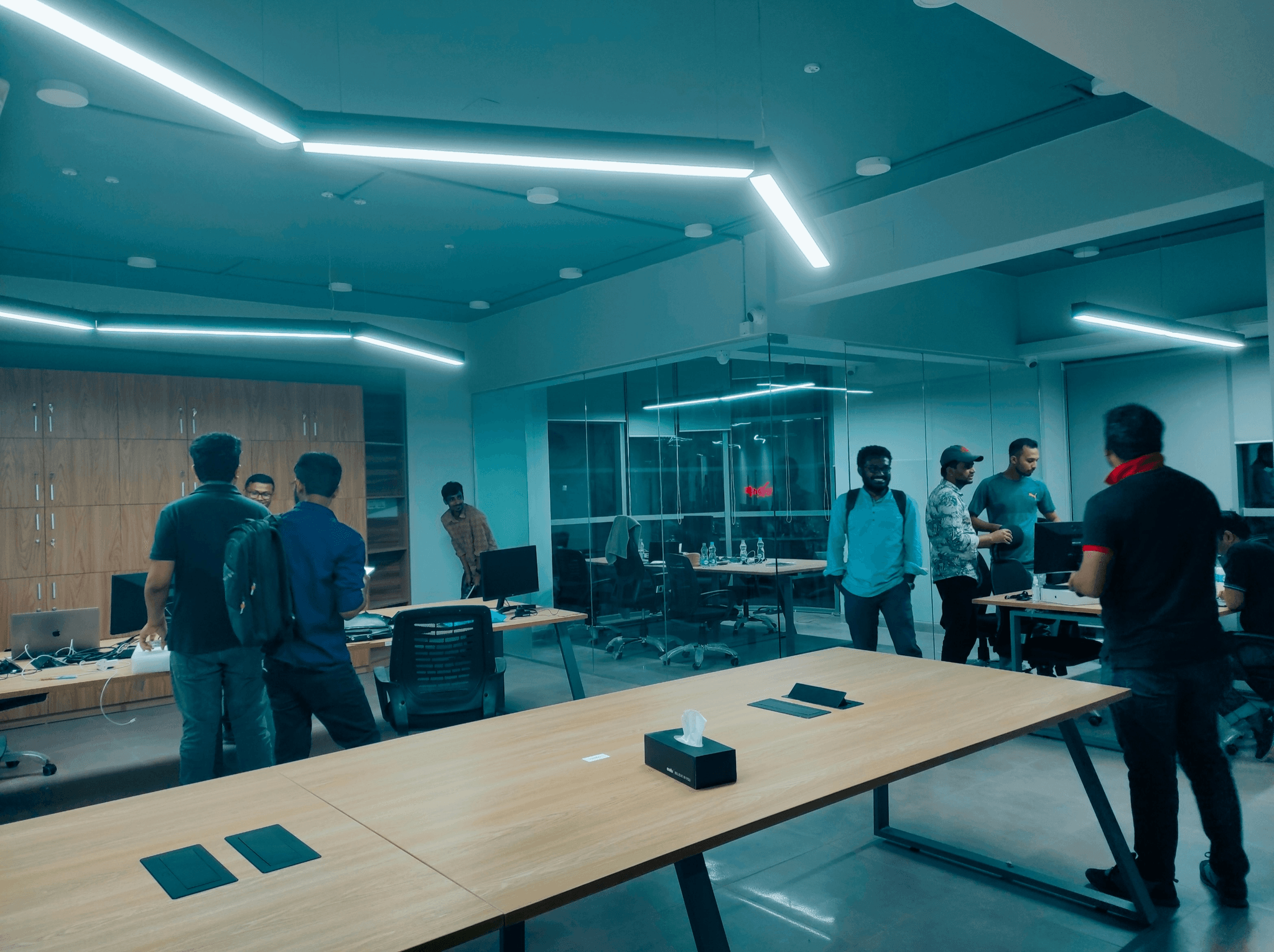 Meeting at a manufacturing sourcing company discussing budget maximization strategies.