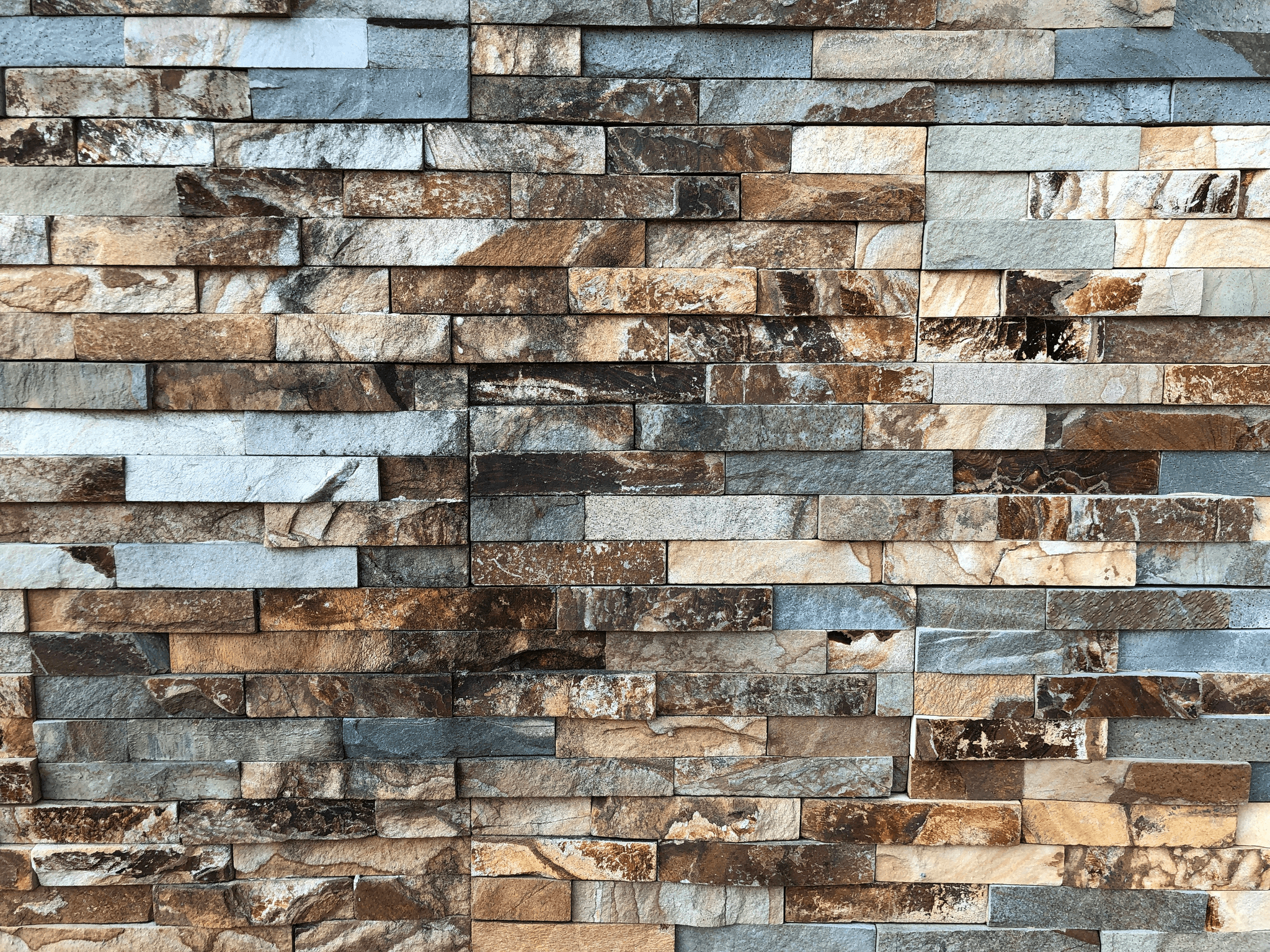 Assortment of natural stone tiles showcasing different types of tiled flooring