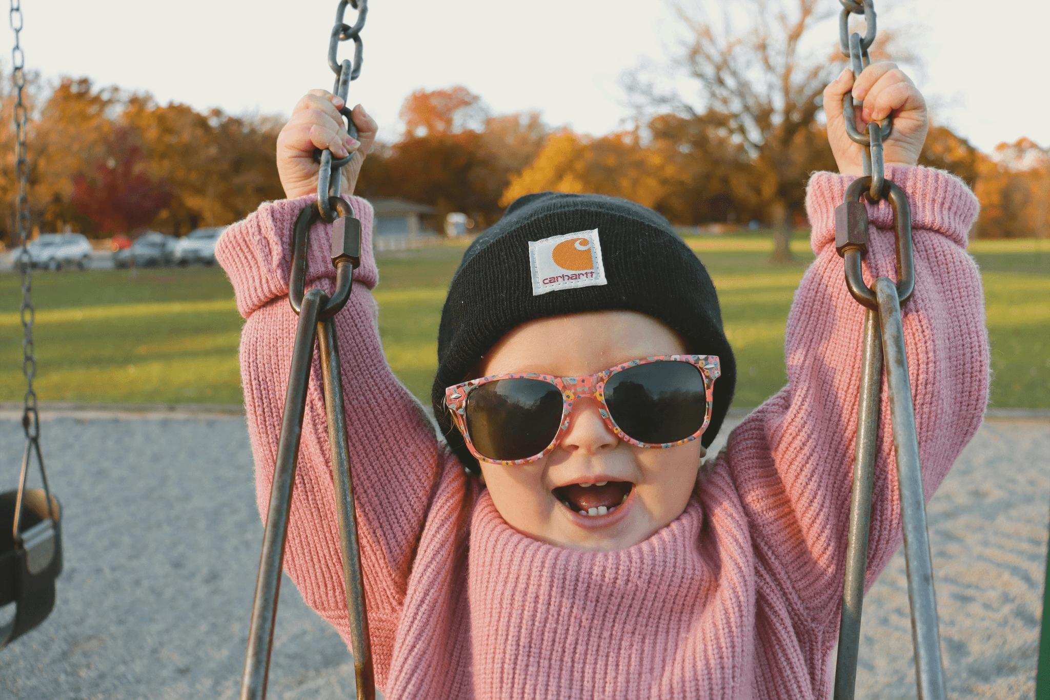 Kid sunglasses bulk: infant wearing stylish shades outdoors.