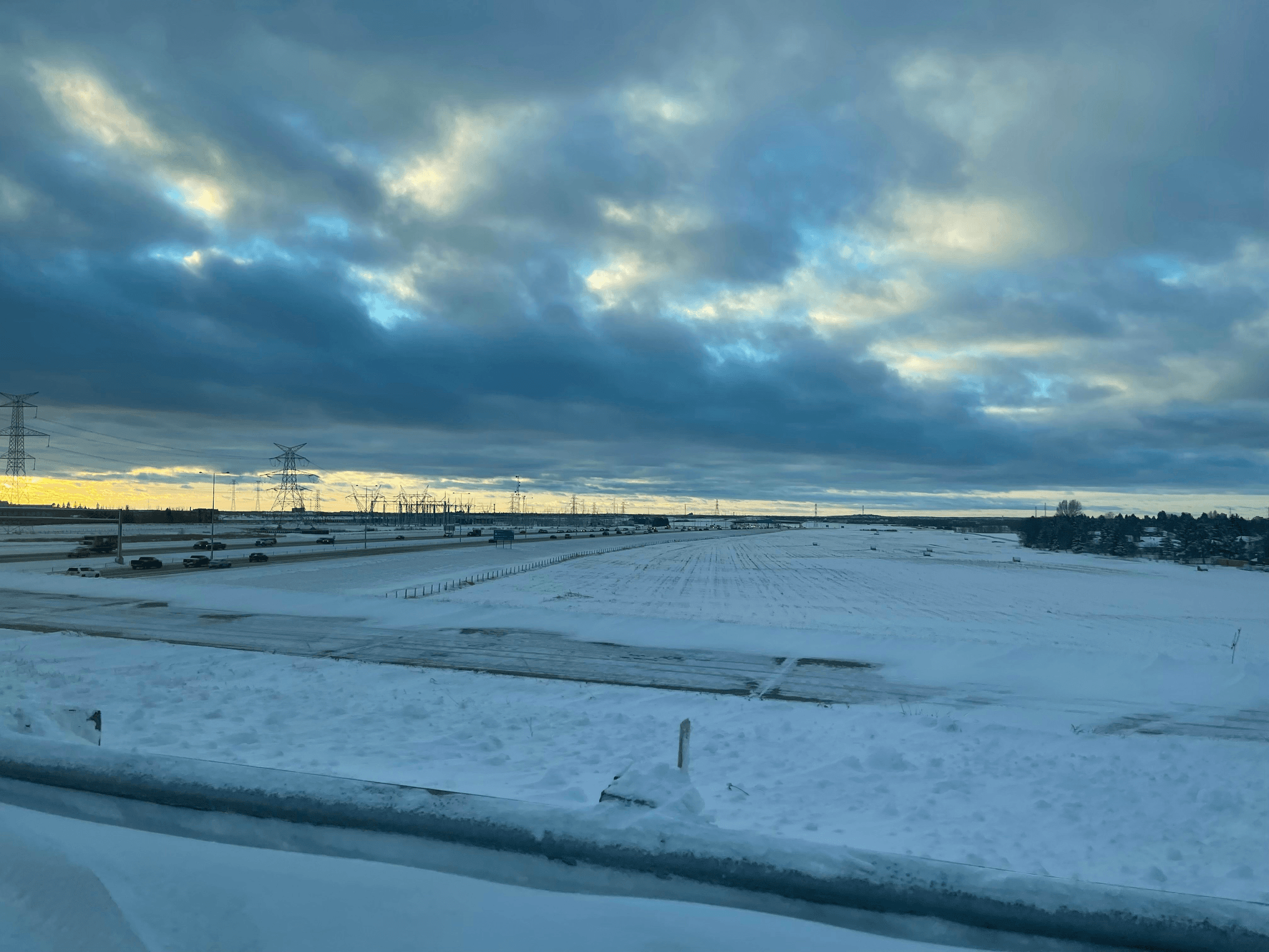 airport snow removal equipment in action during snowfall