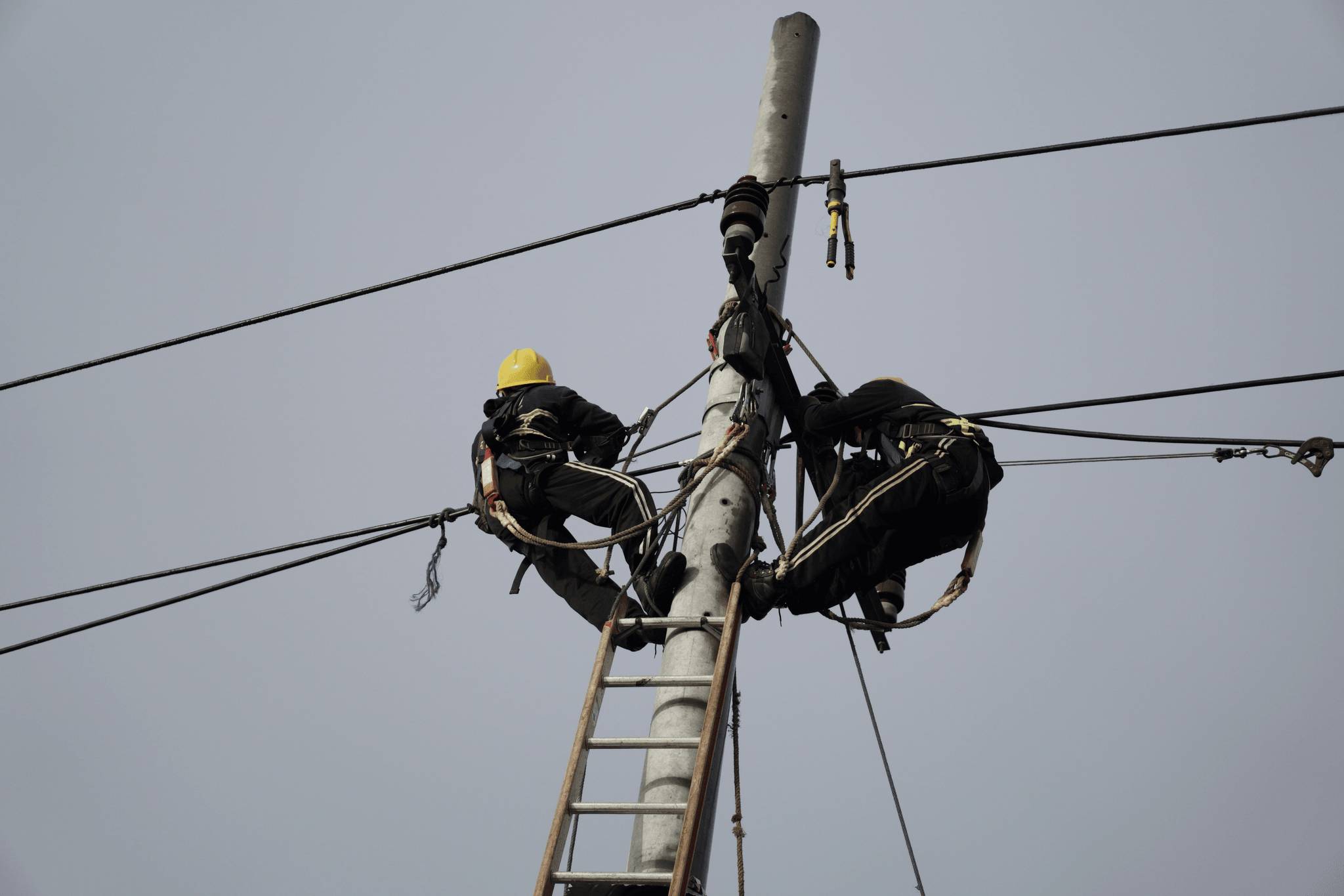 Electric pole guy wire installation process