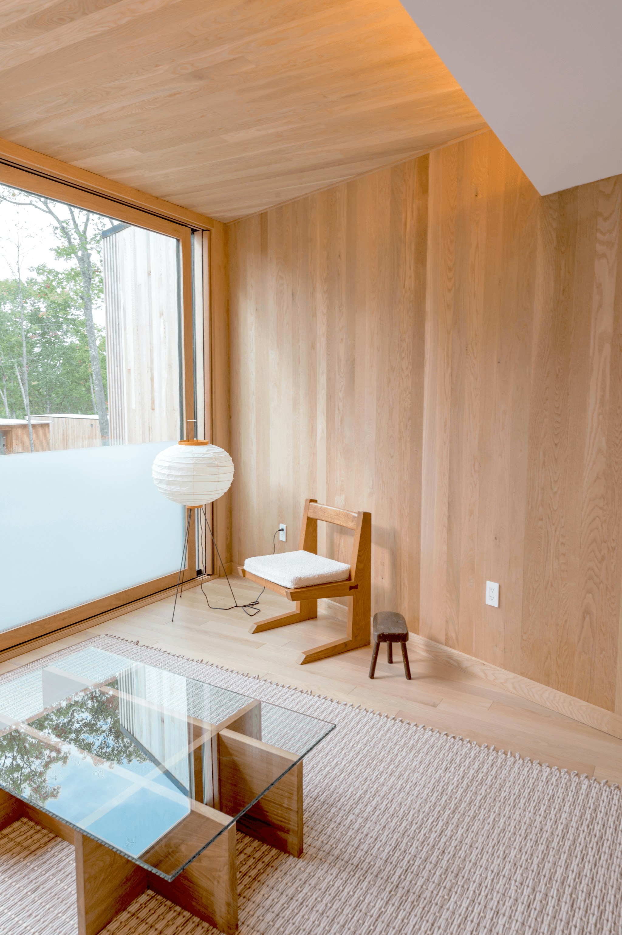 Creating Sustainable Interior with Reclaimed Wood Paneling for Making a Shipping Container Home