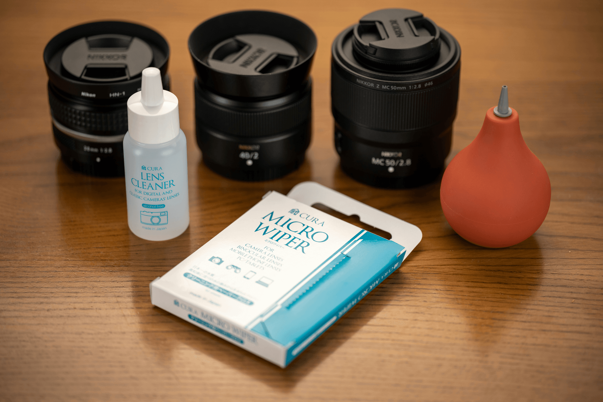 Glasses cleaning kit with microfiber cloth, cleaning solution, and case.
