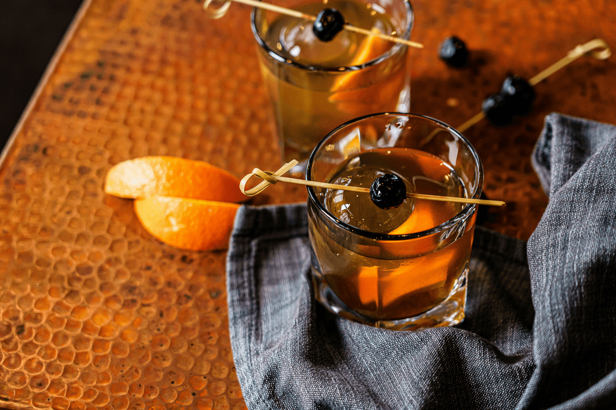 Old Fashioned Hive Craft Cocktail infusion kit featuring dehydrated oranges, cherries, and infused sugar cubes in a glass jar labeled “Pour Decisions Perfected.” A timeless cocktail blend designed for whiskey lovers.