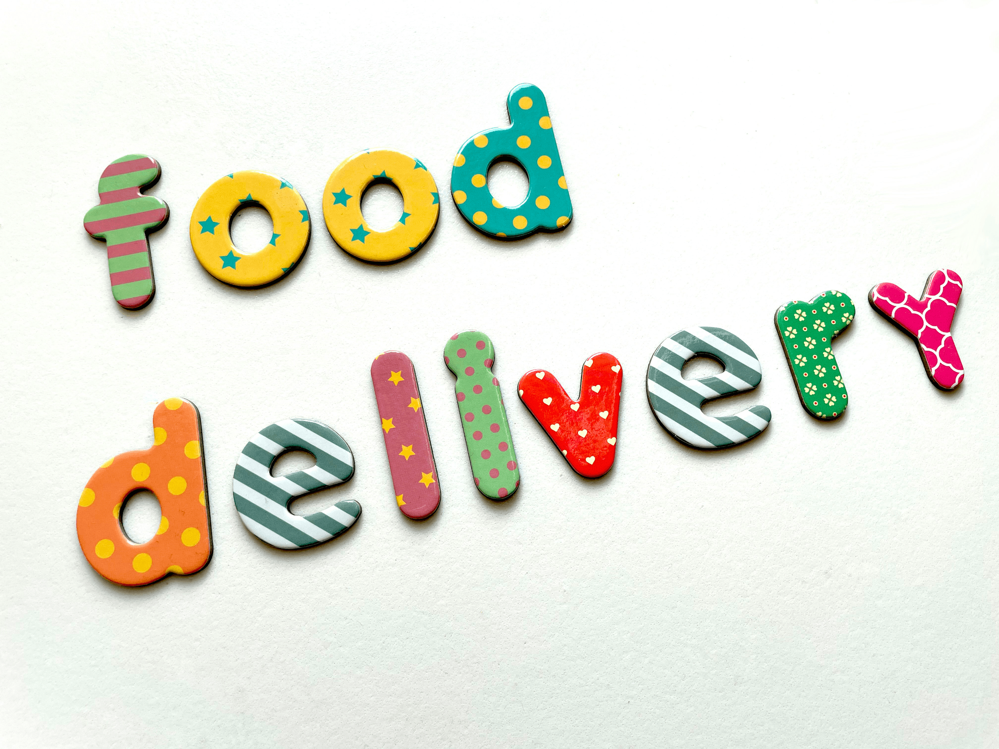 Variety of custom food delivery boxes showcasing branding and meals