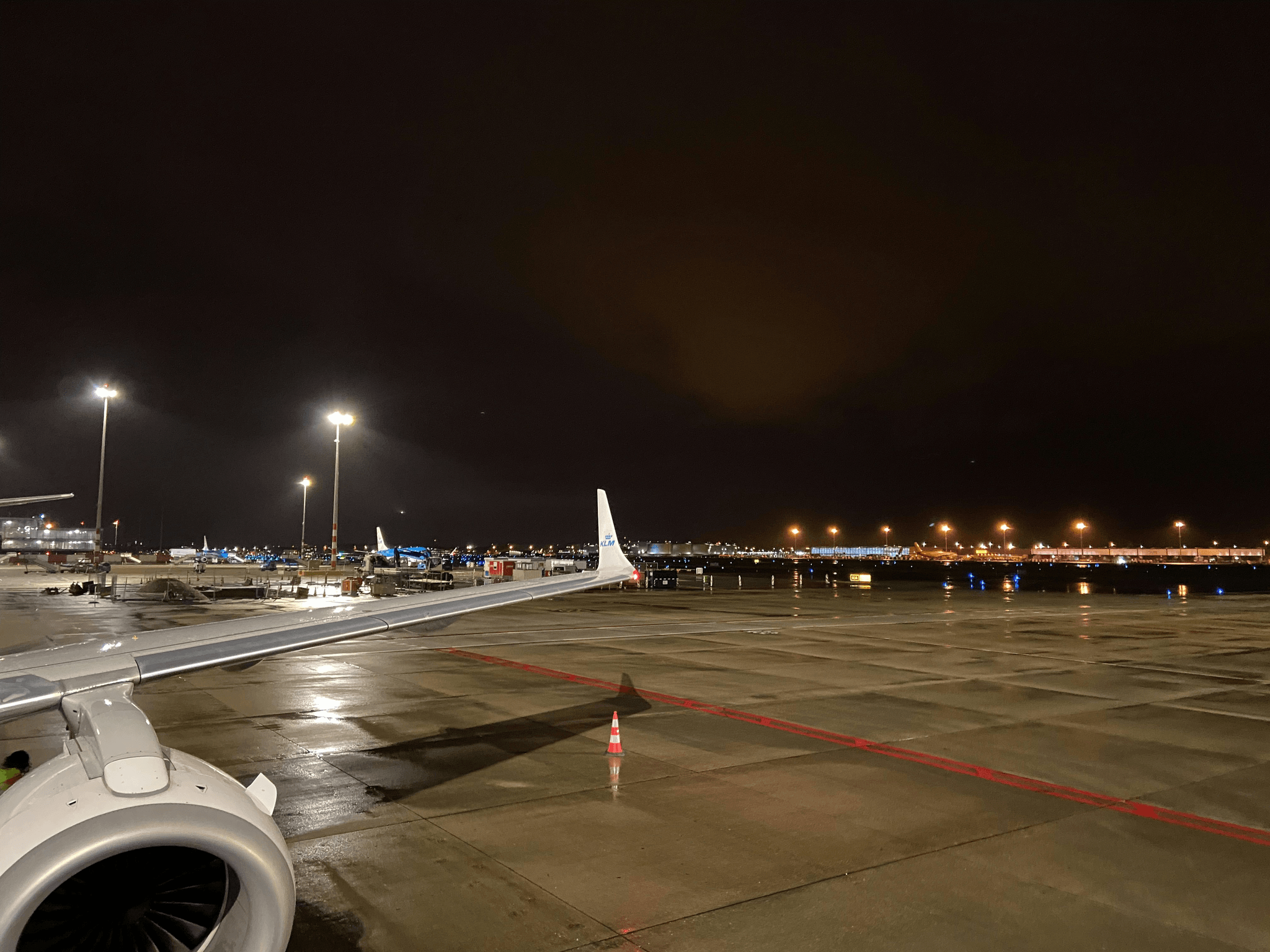 Airport lights illuminating a runway at night.