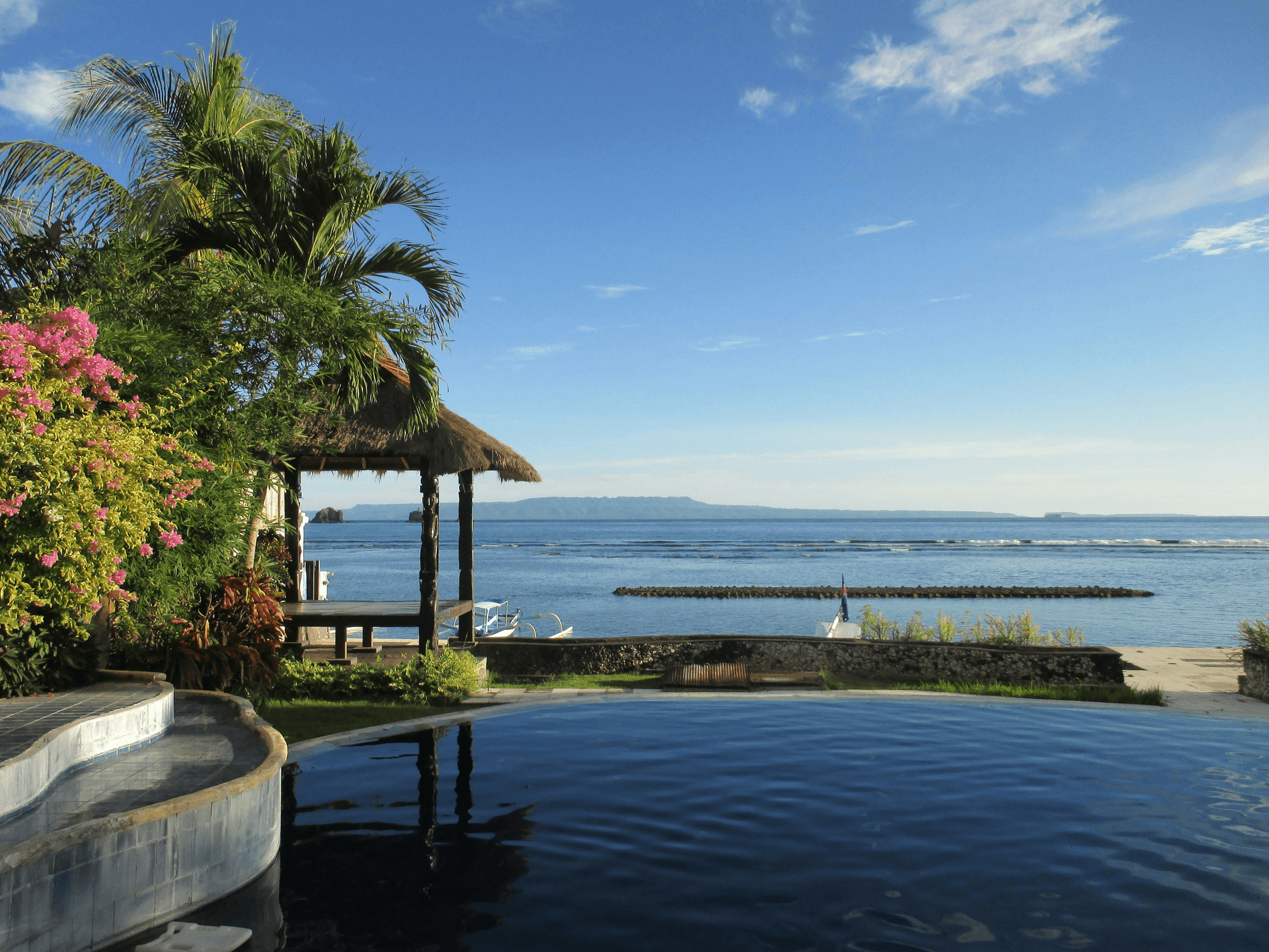 Luxury travel beachfront villa with private infinity pool