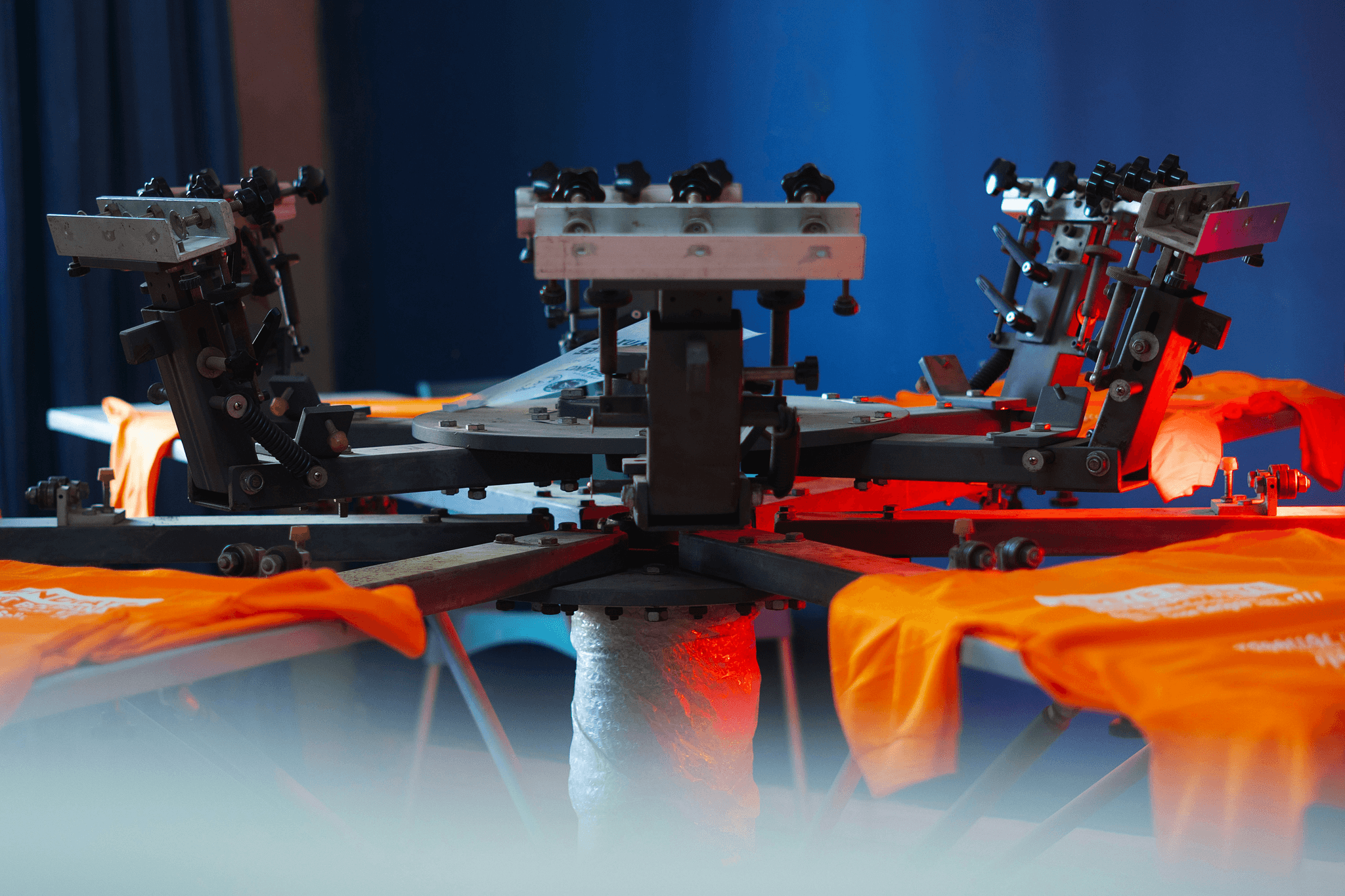 Vibrant custom-designed shirts being printed using advanced techniques for on-demand shirt printing