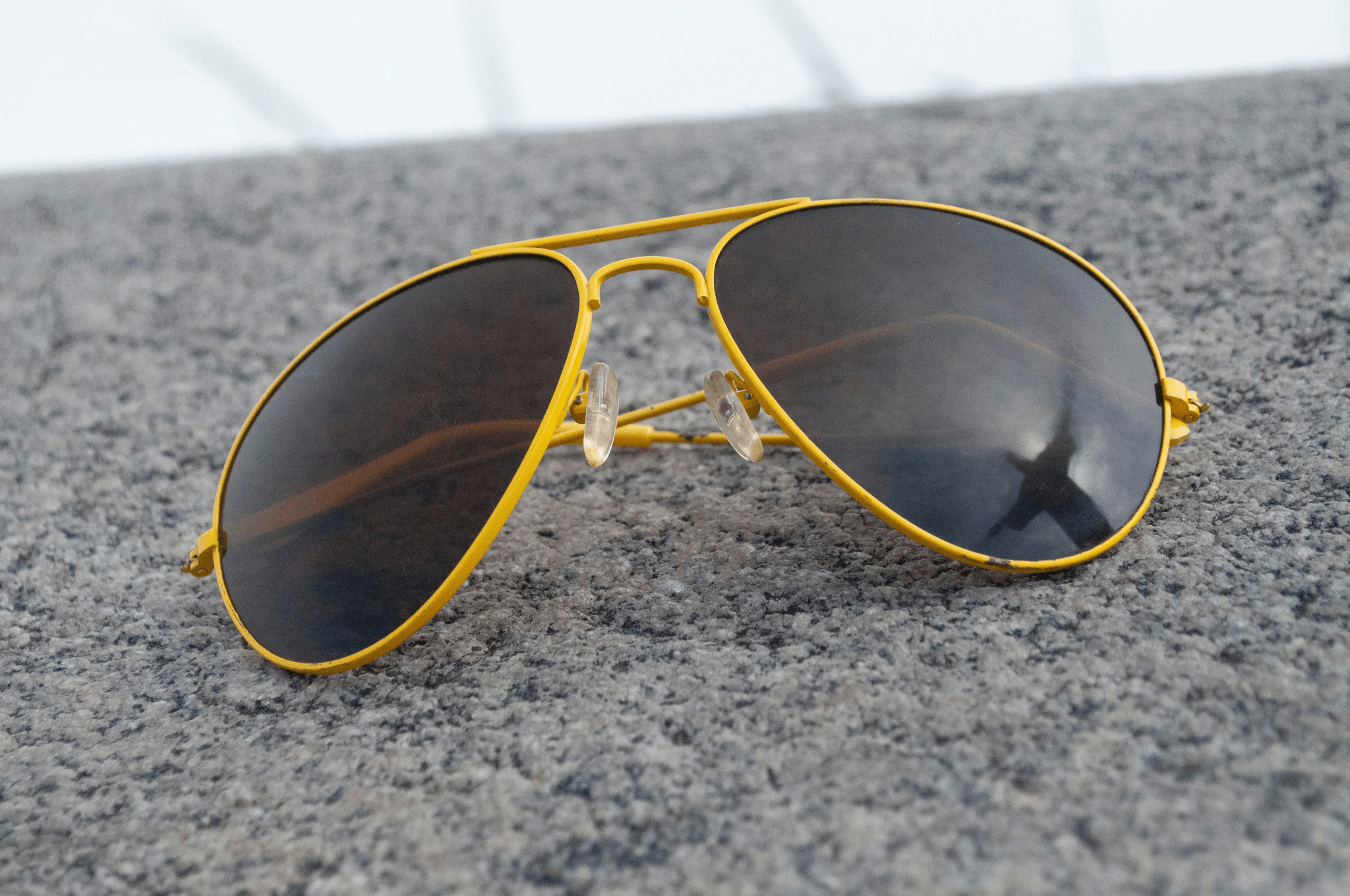 Black aviator-style private label sunglasses
