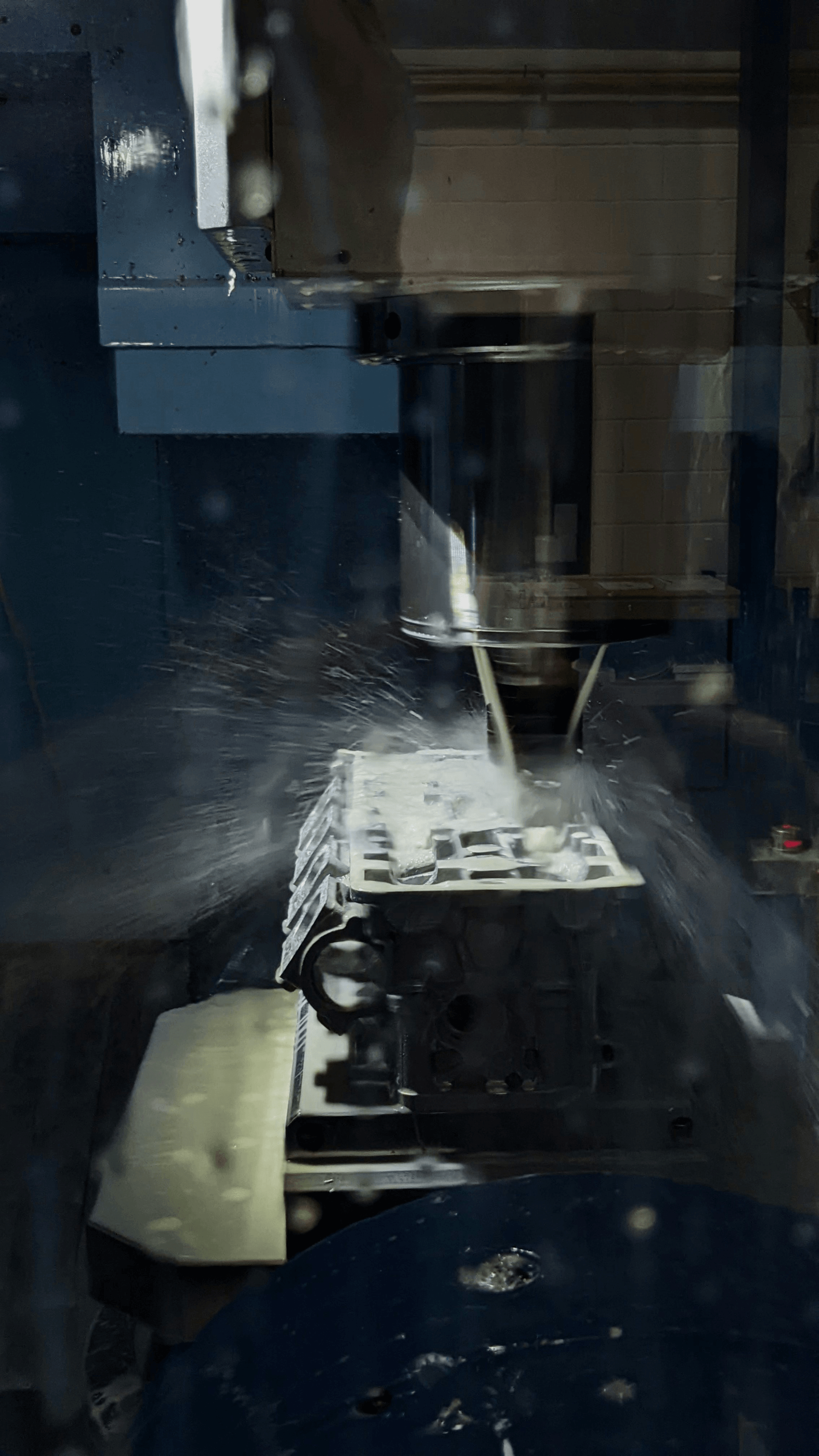 Waterjet machining process being performed by CNC machine at SSOURCING INC.