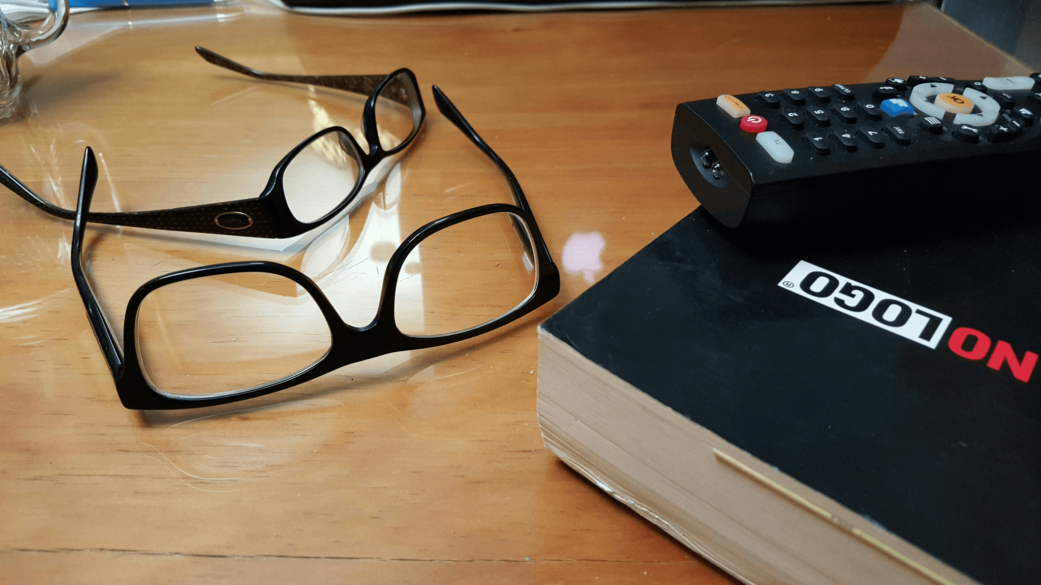 Stylish distance and reading glasses combined on display stand