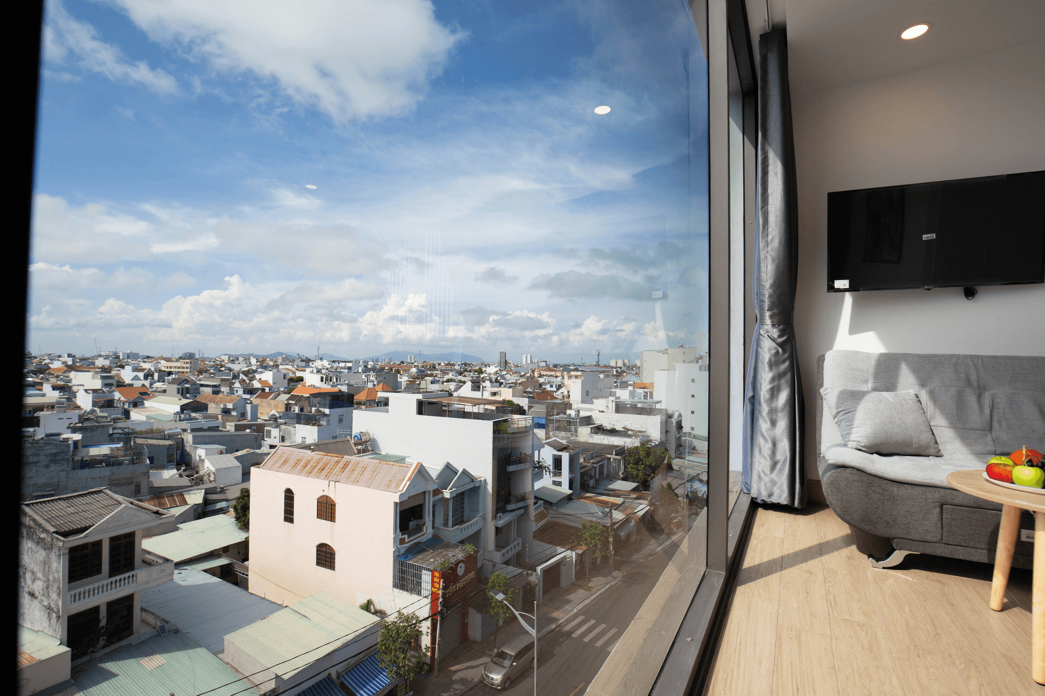 Modern white capsule house overlooking green landscape