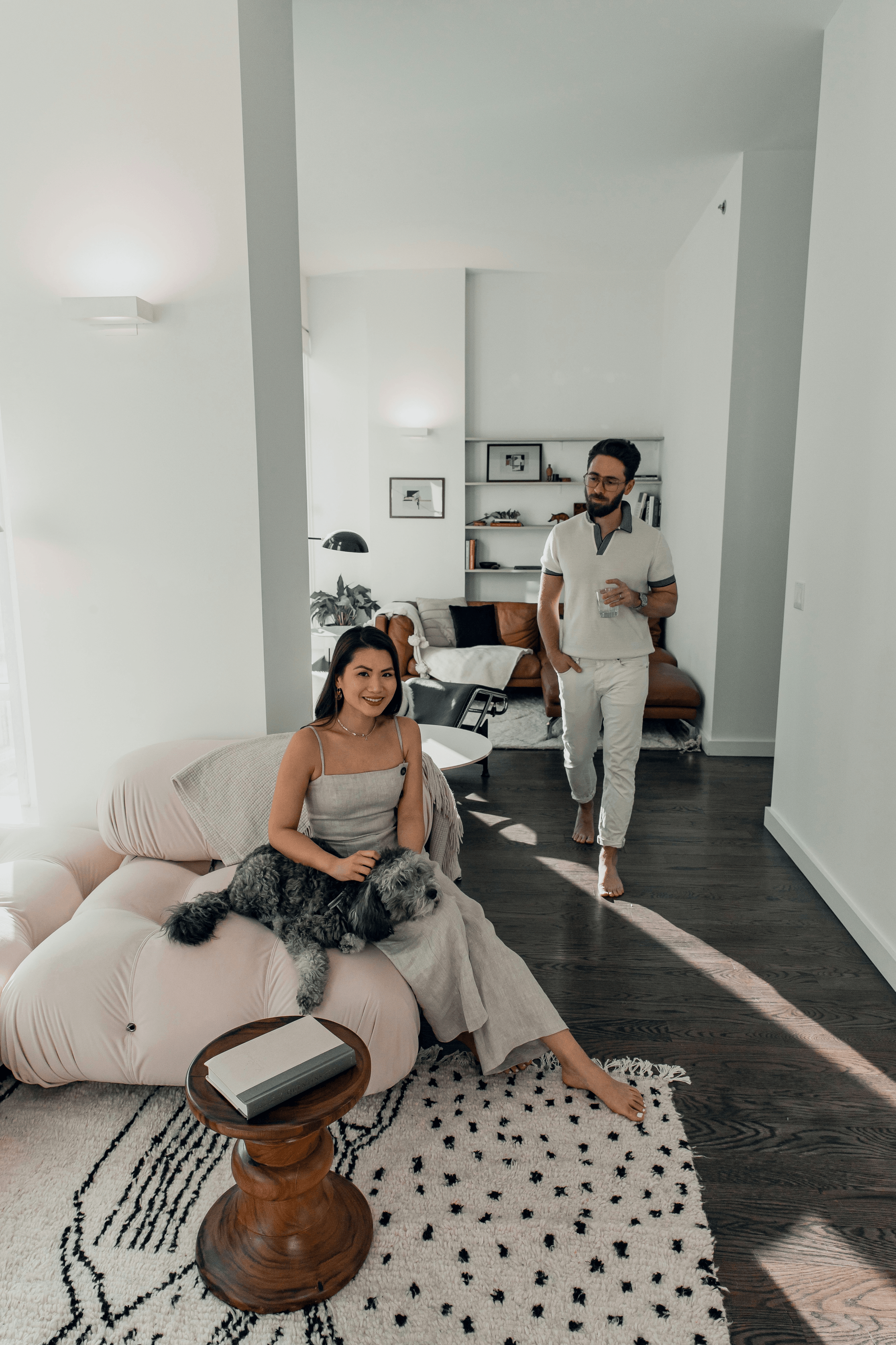 Happy young professional couple enjoying affordable living in their new capsule house