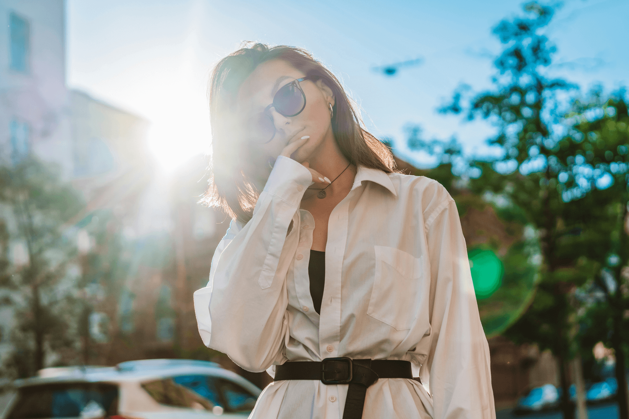 woman in wayfarer gradient sunglasses enjoying sunny day