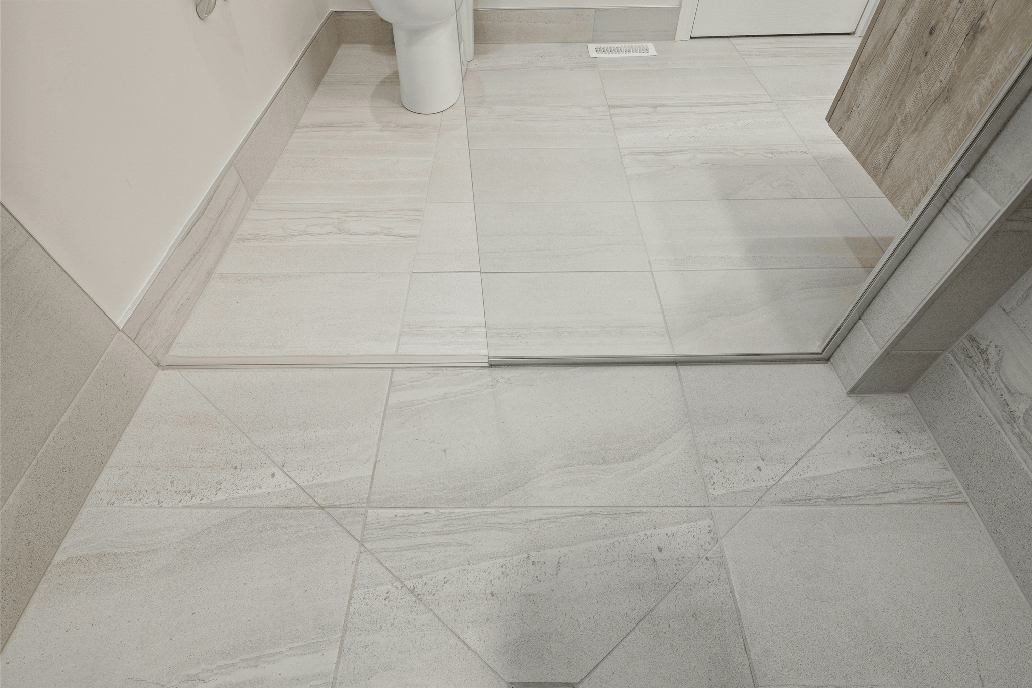 Shower floor tile options displayed in a bathroom setting