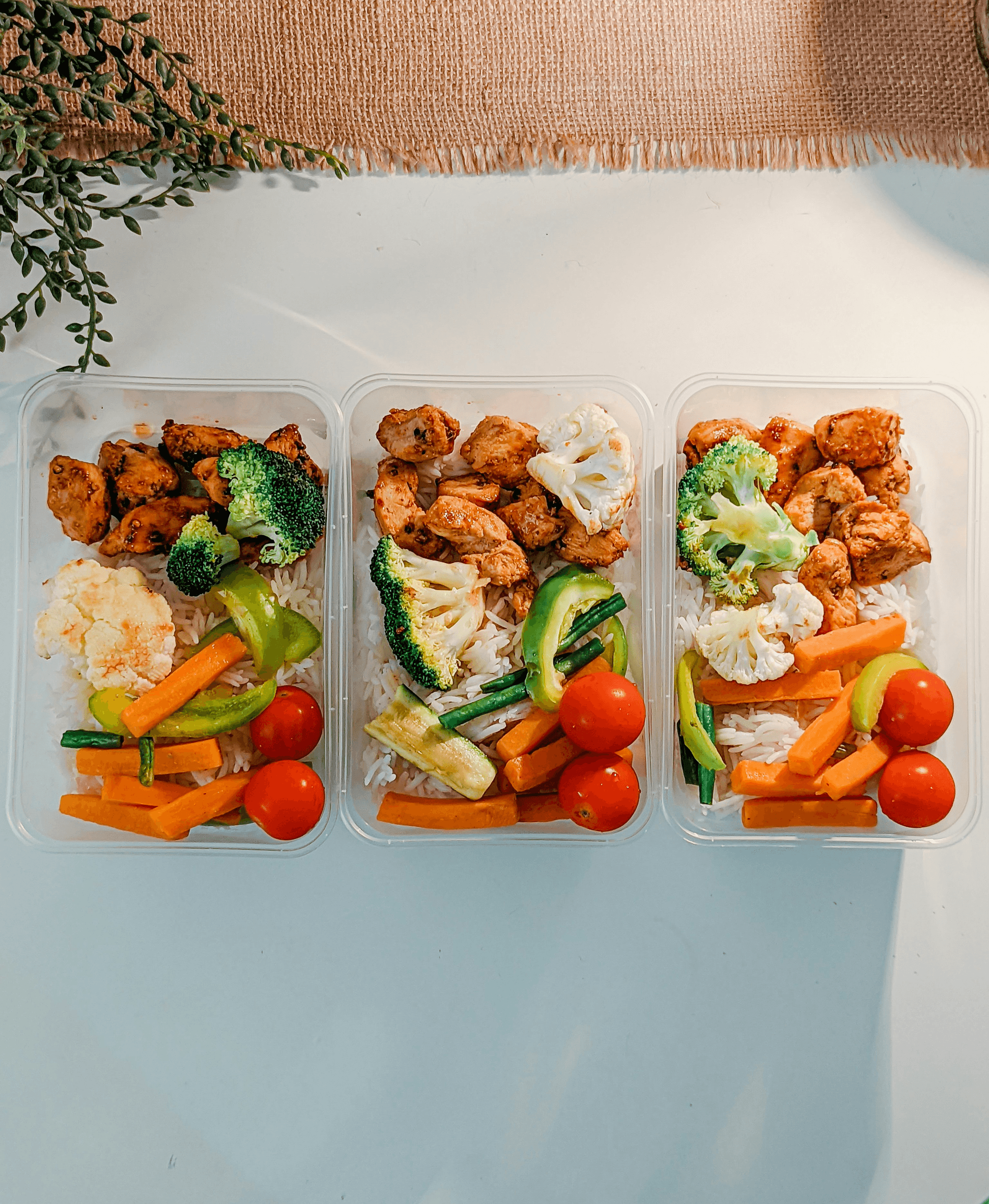 Assorted food delivery containers for takeout meals.