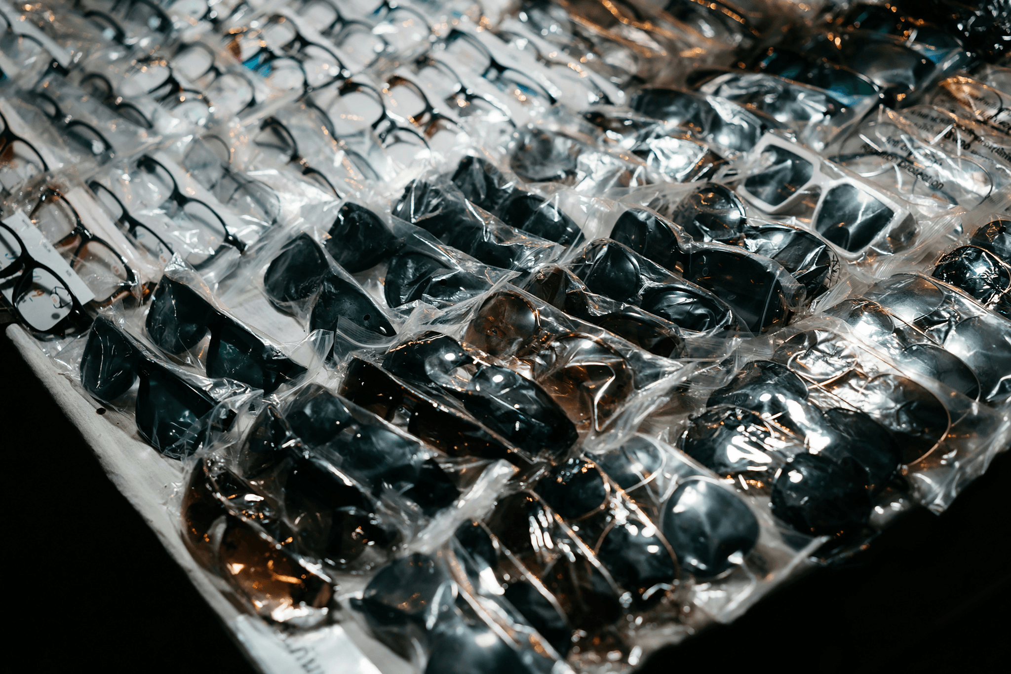 Customizable sunglasses in bulk orders being packaged and shipped