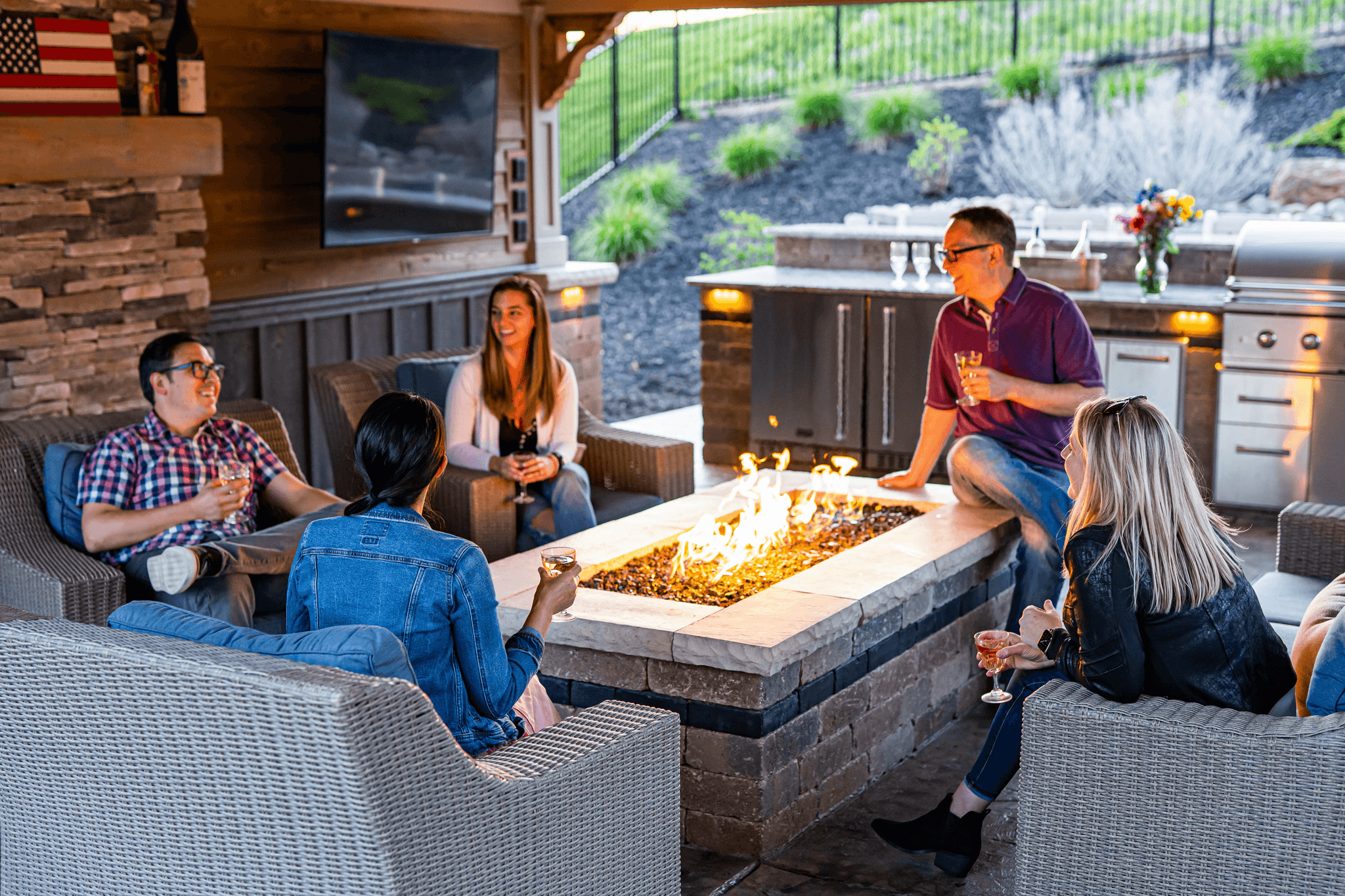 Cozy backyard deck with fire pit perfect for entertaining.