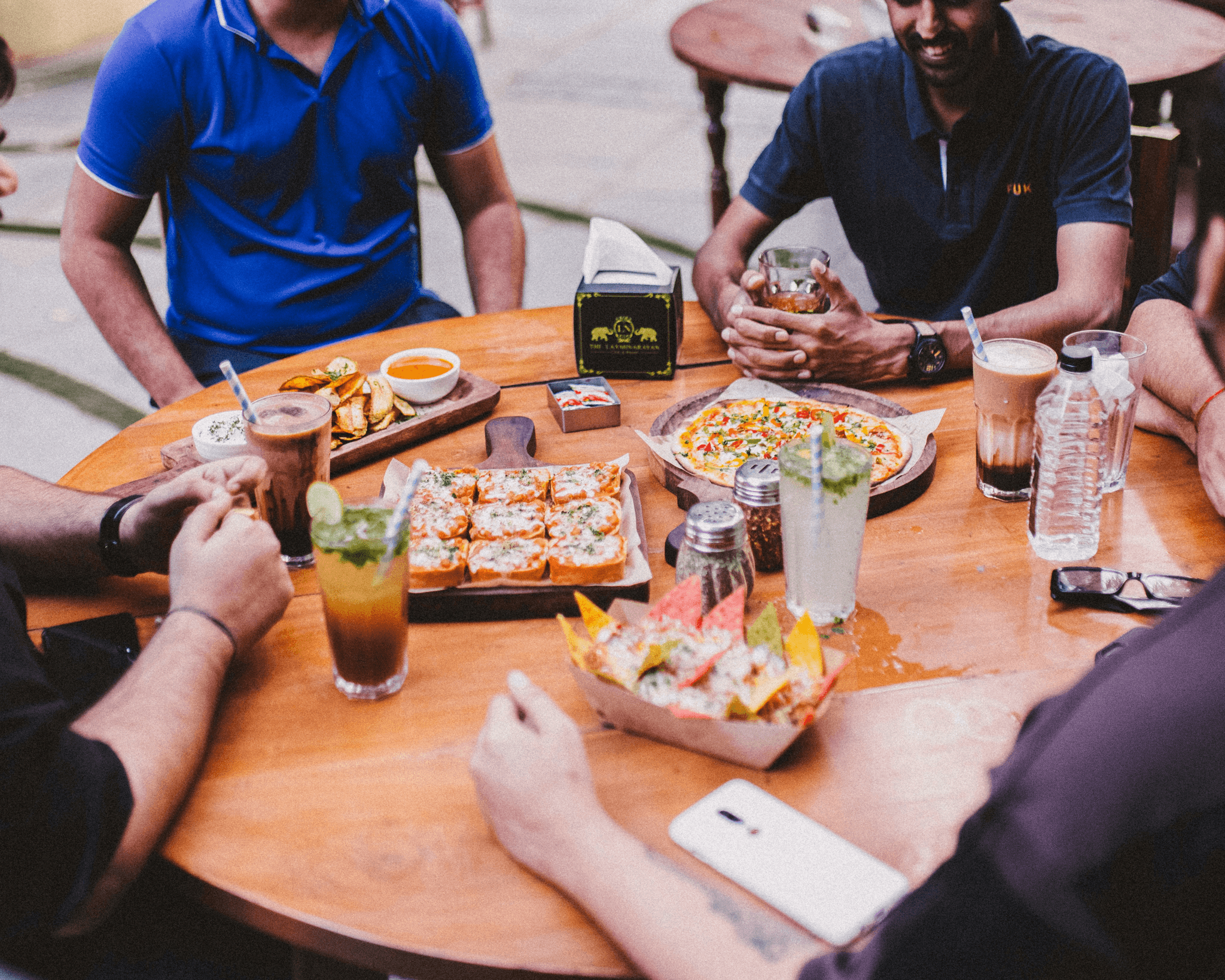 Diverse group enjoying food at a vibrant pop-up restaurant