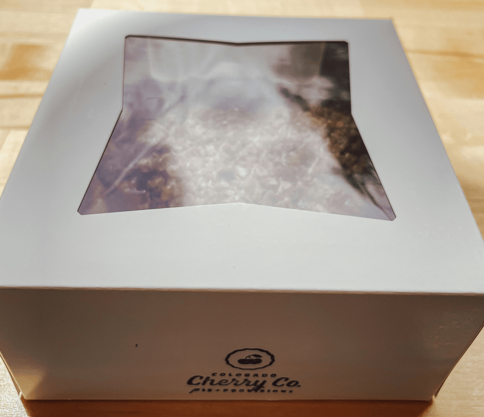 Beautiful custom cake boxes featuring unique designs and logos.