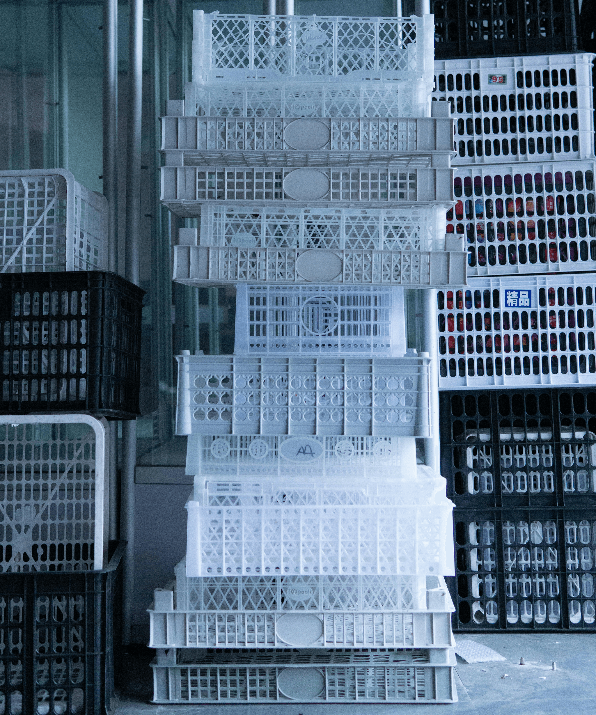 Neatly stacked foldable containers in warehouse setting