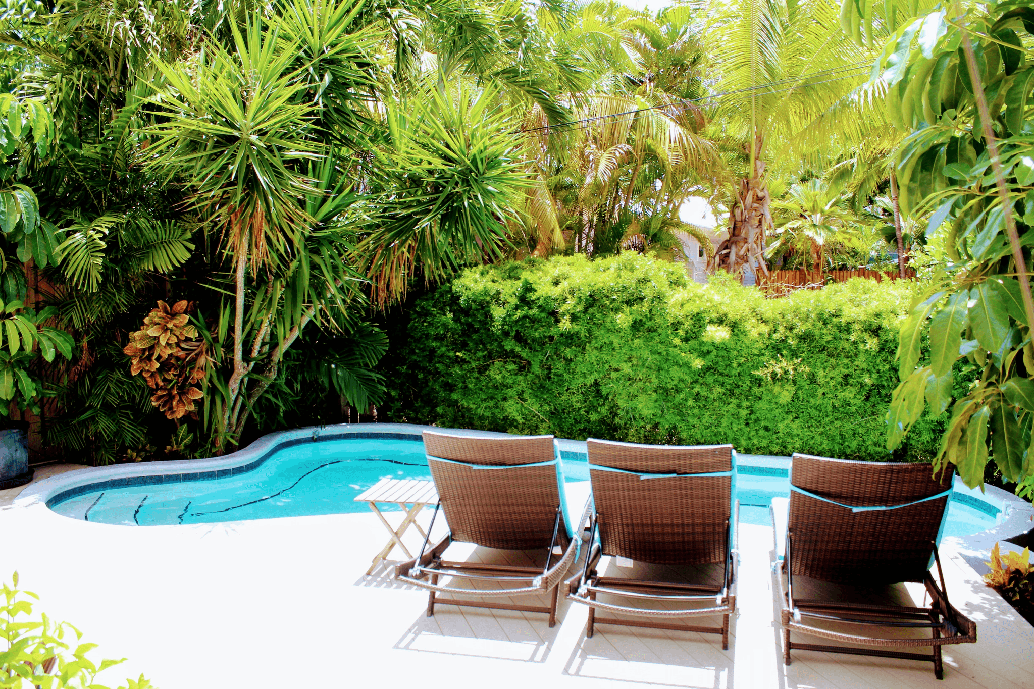 composite decking around inground pool enhances outdoor aesthetics.