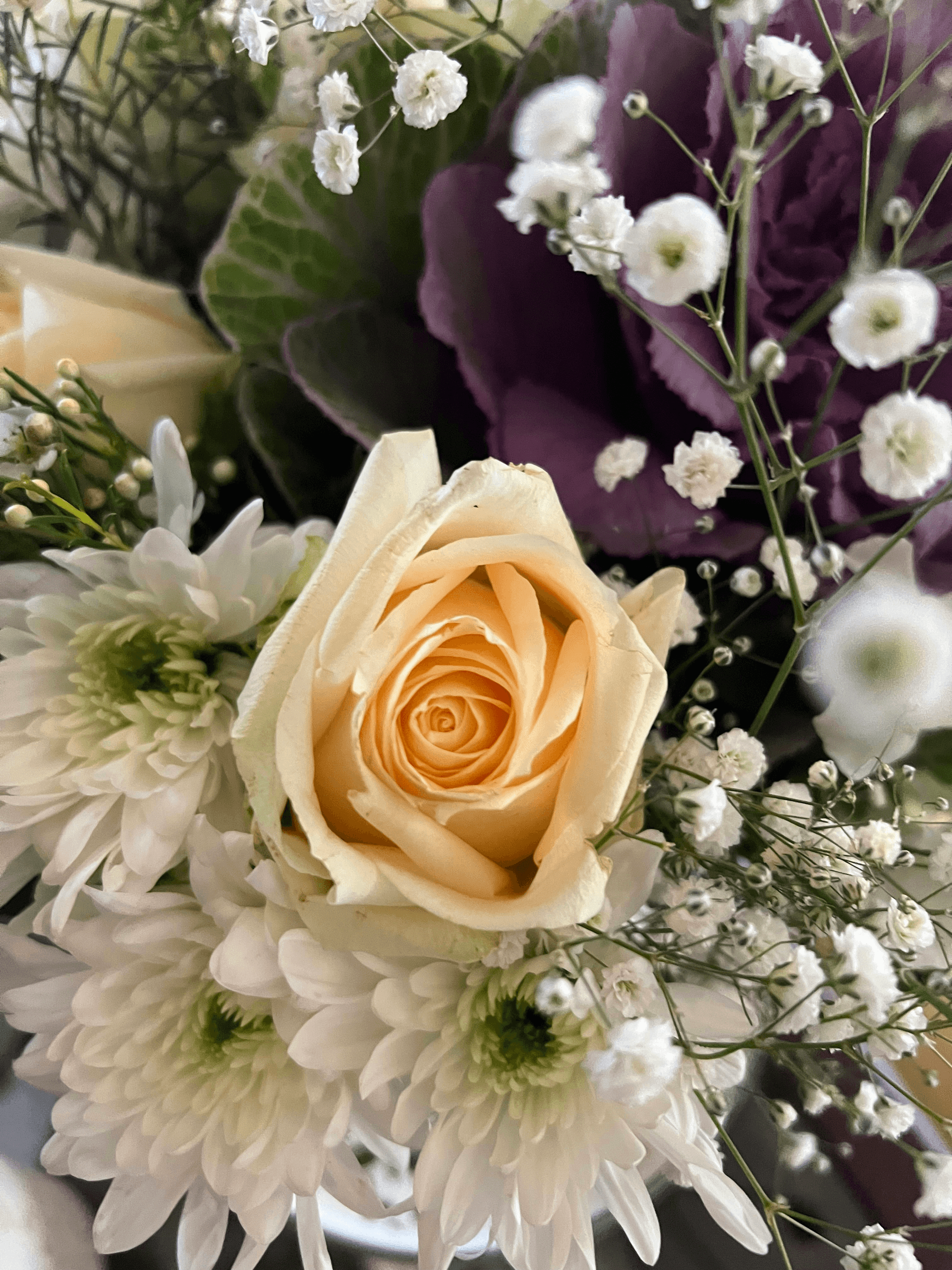Colorful bouquet of fresh flowers in a glass vase.