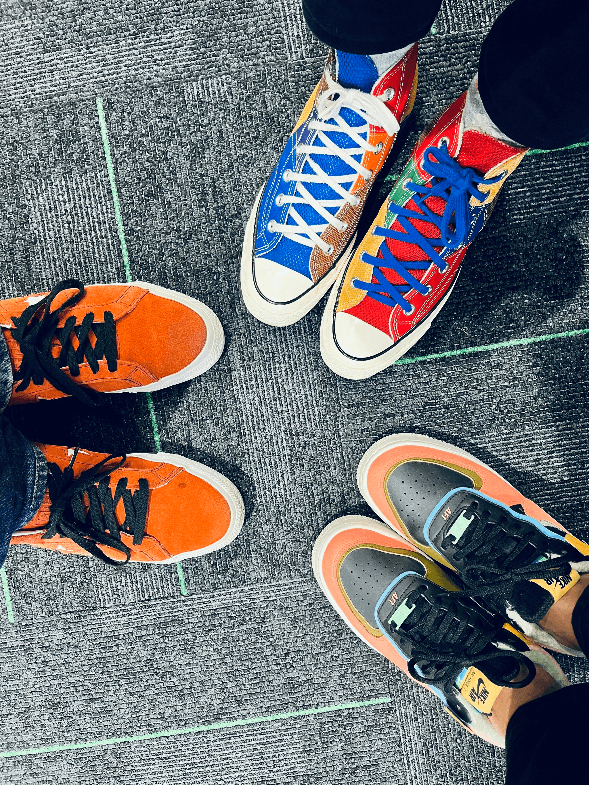 Happy clients showcase unique designs from custom shoe manufacturers.