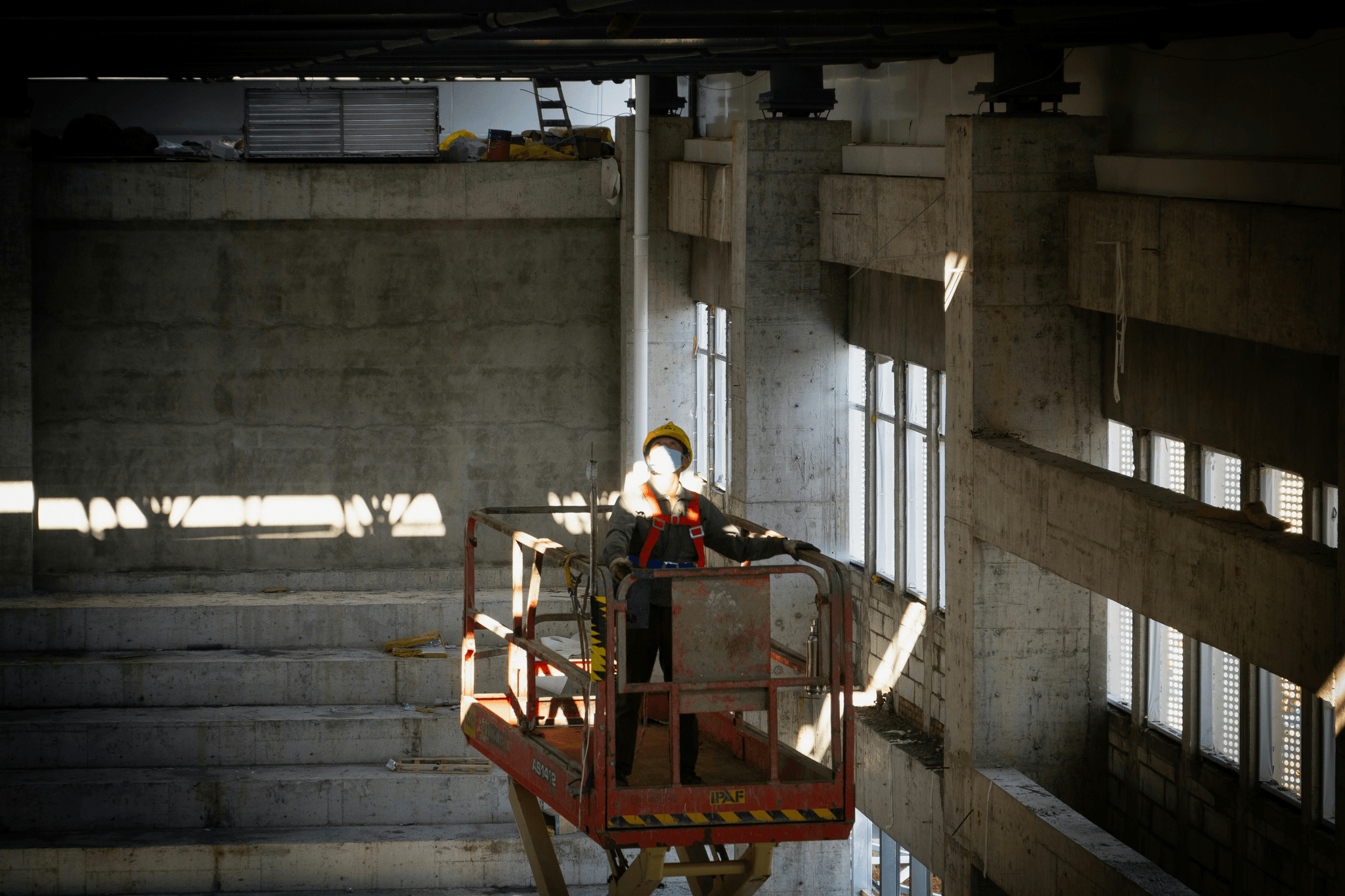 on-site during inspections: inspector checking list amidst busy workers