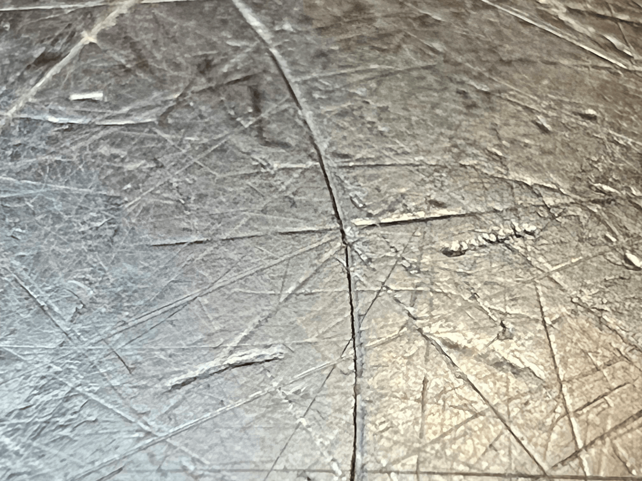 Proper cleaning techniques for preparing surfaces with aluminum foil adhesive