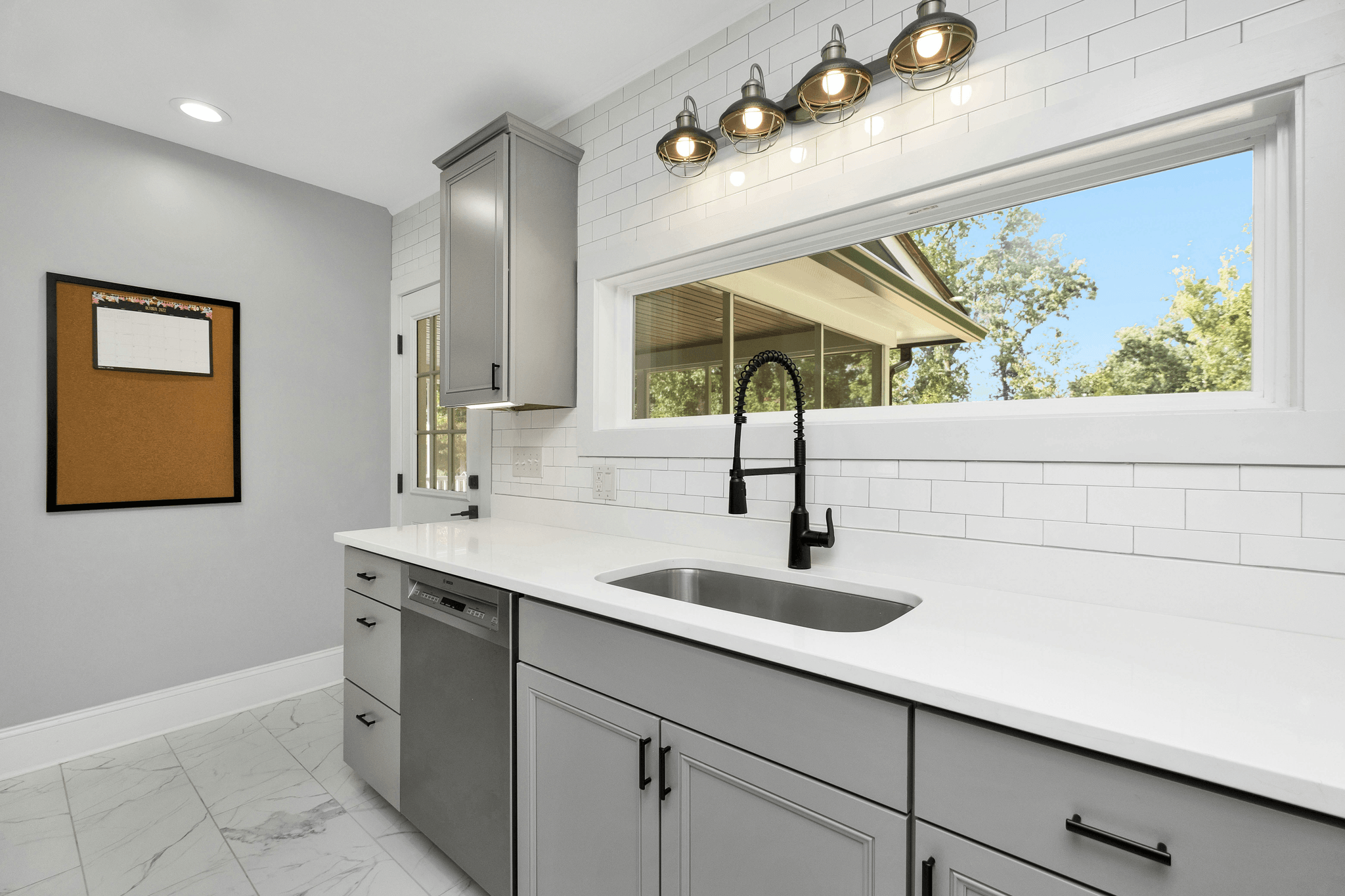Stylish modern kitchen with sleek corner sink base cabinet for clever storage solutions