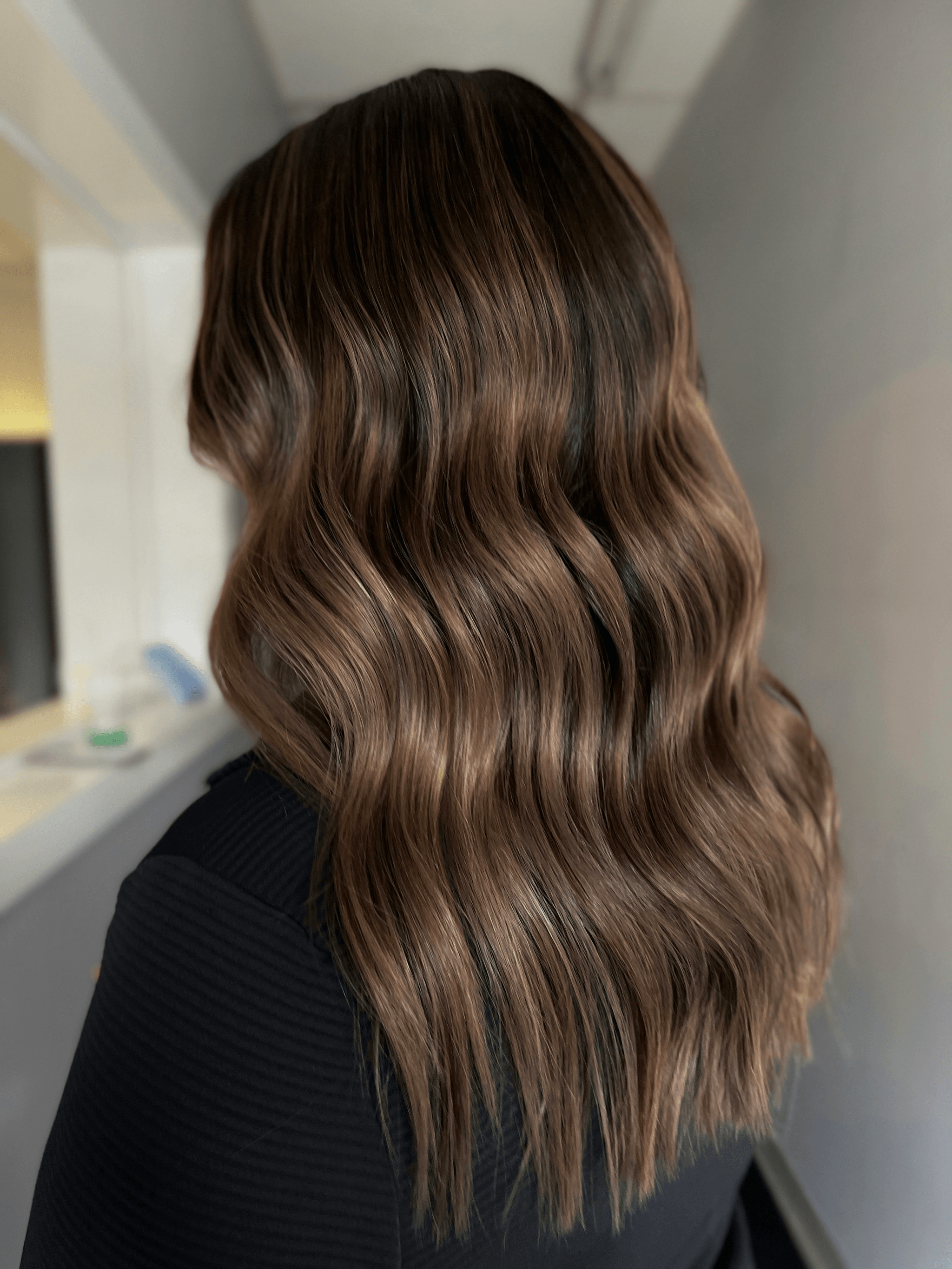 Ombre Hairstyle featuring shiny caramel tones for curly or wavy hair