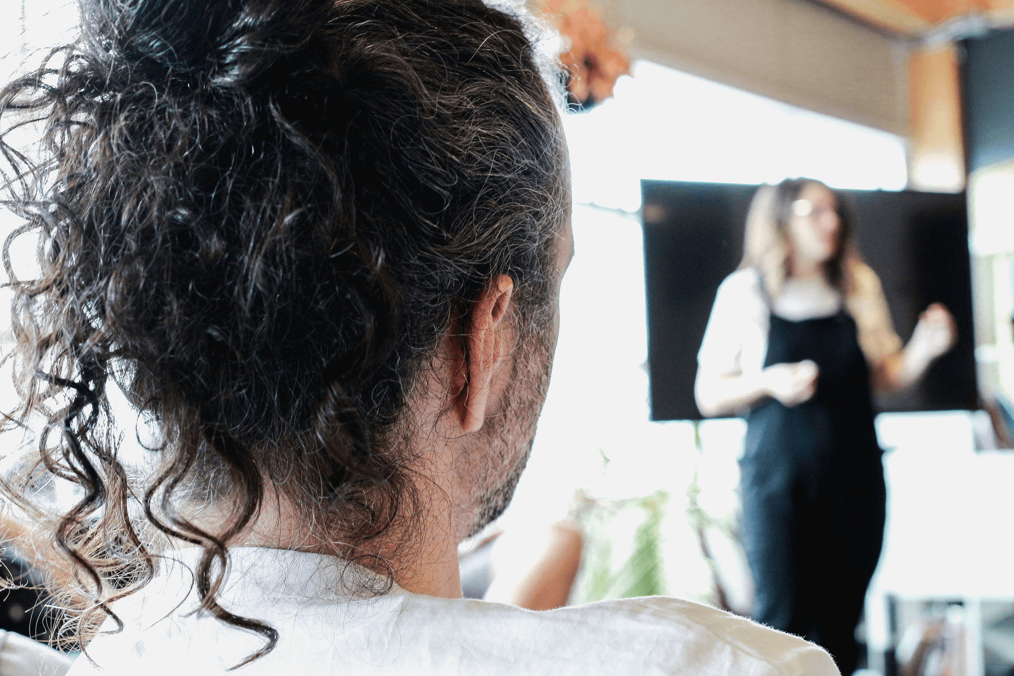 Workshop showcasing wholesale virgin hair care techniques.