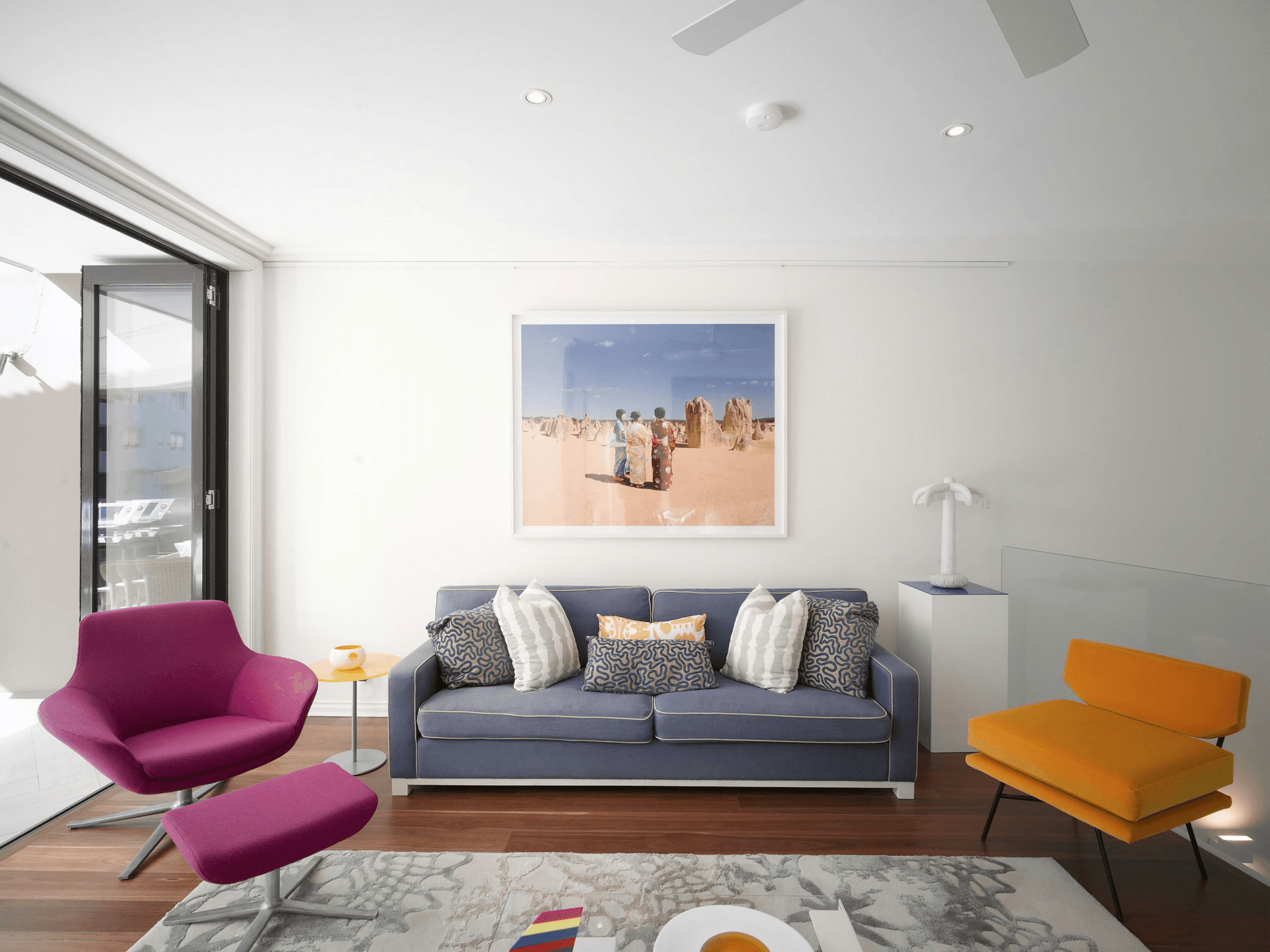 Modern living room with cleverly designed furniture offering hidden storage compartments