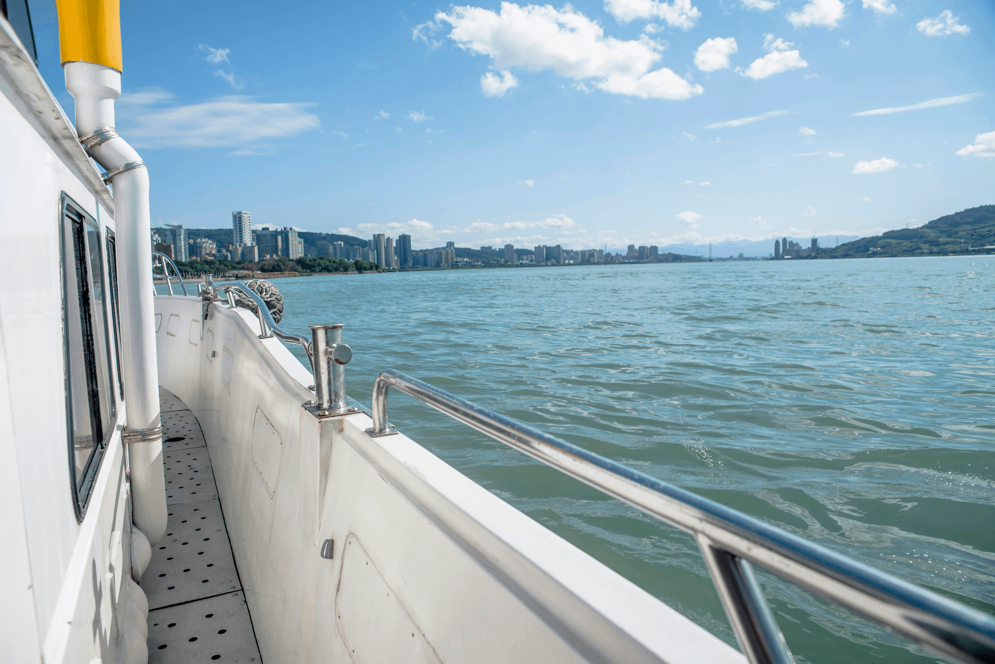 double decker pontoon boat with slide enjoying sunny day on water