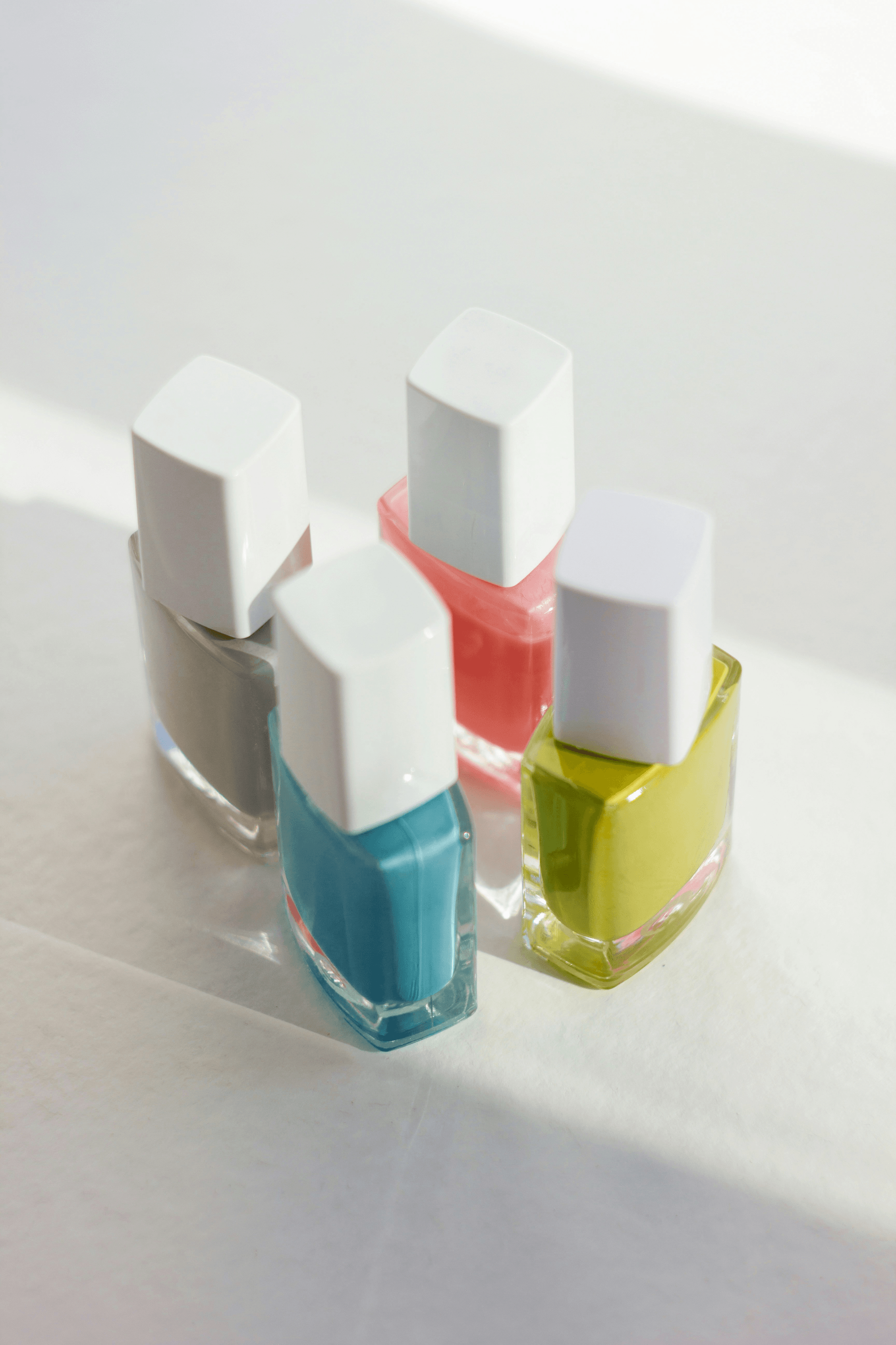 Colorful collection of water based nail polish bottles.