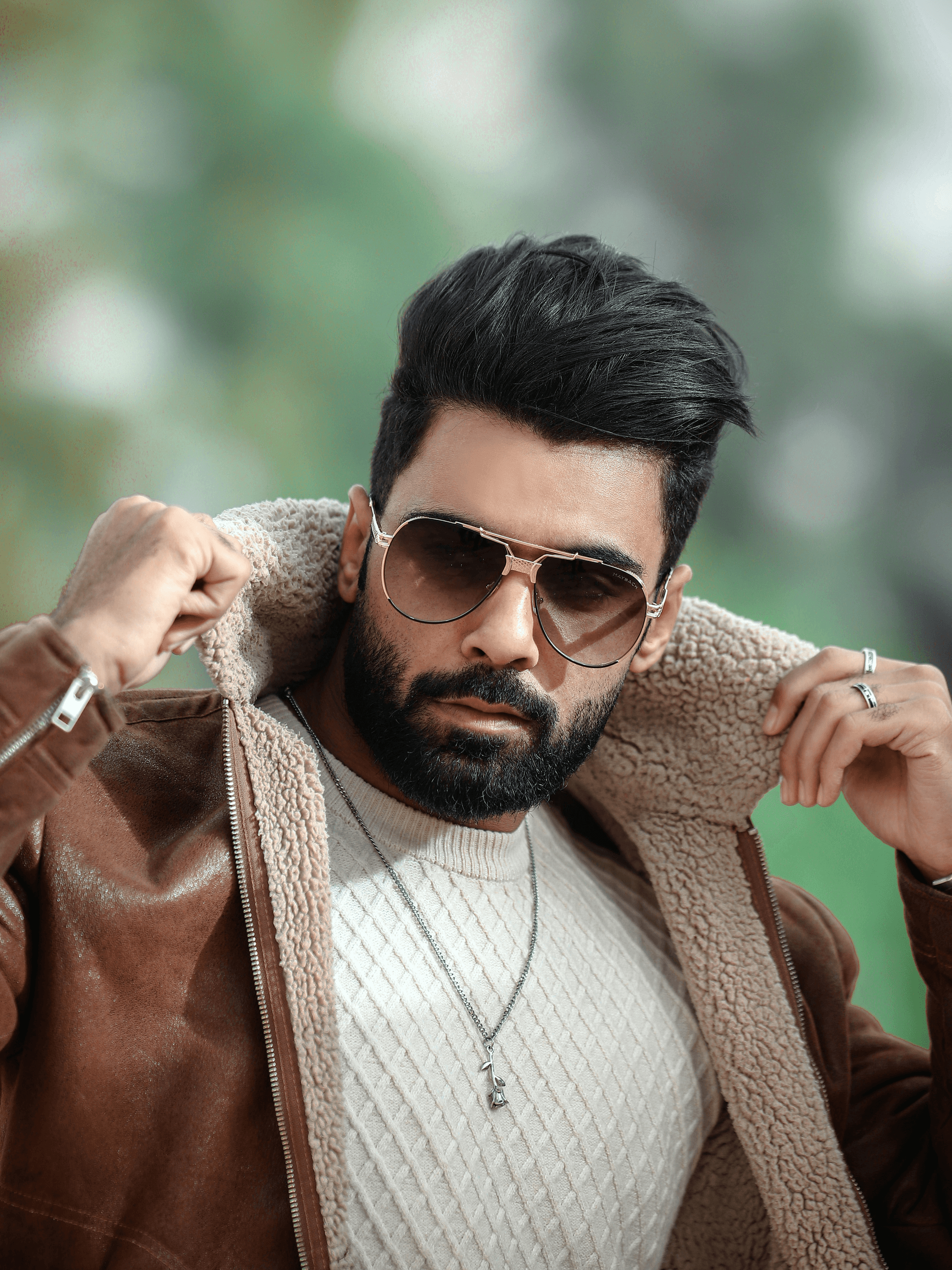 Stylish male aviator sunglasses enhancing outdoor fashion.