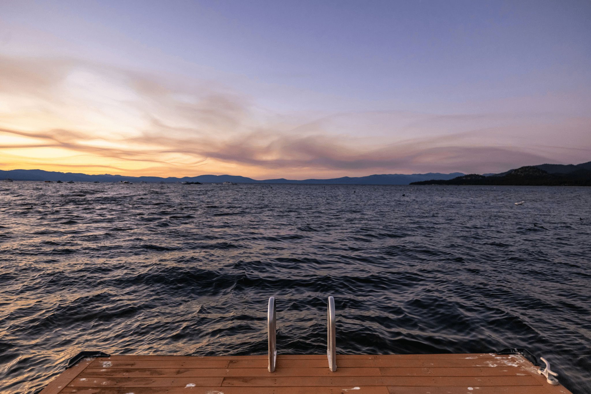 Beautiful view of a boat dock decking material at sunset.