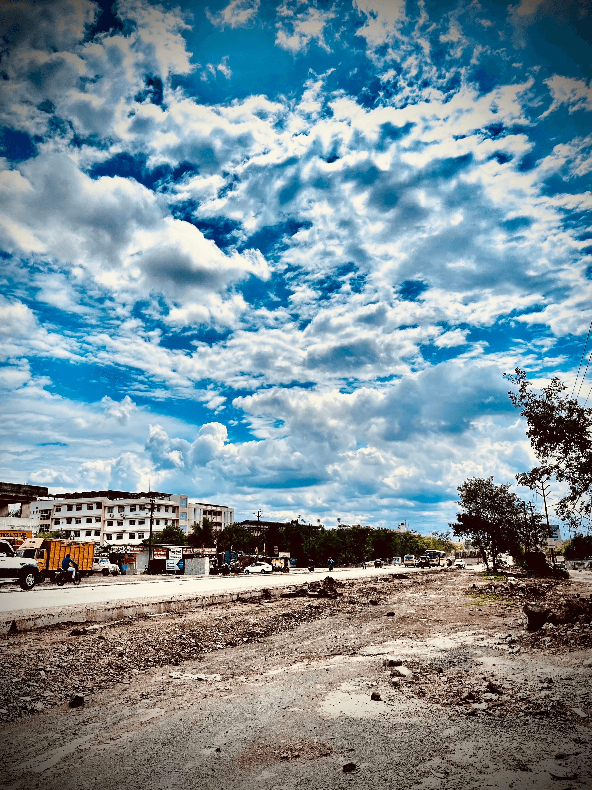 Trucks involved in modular building transportation on a highway.