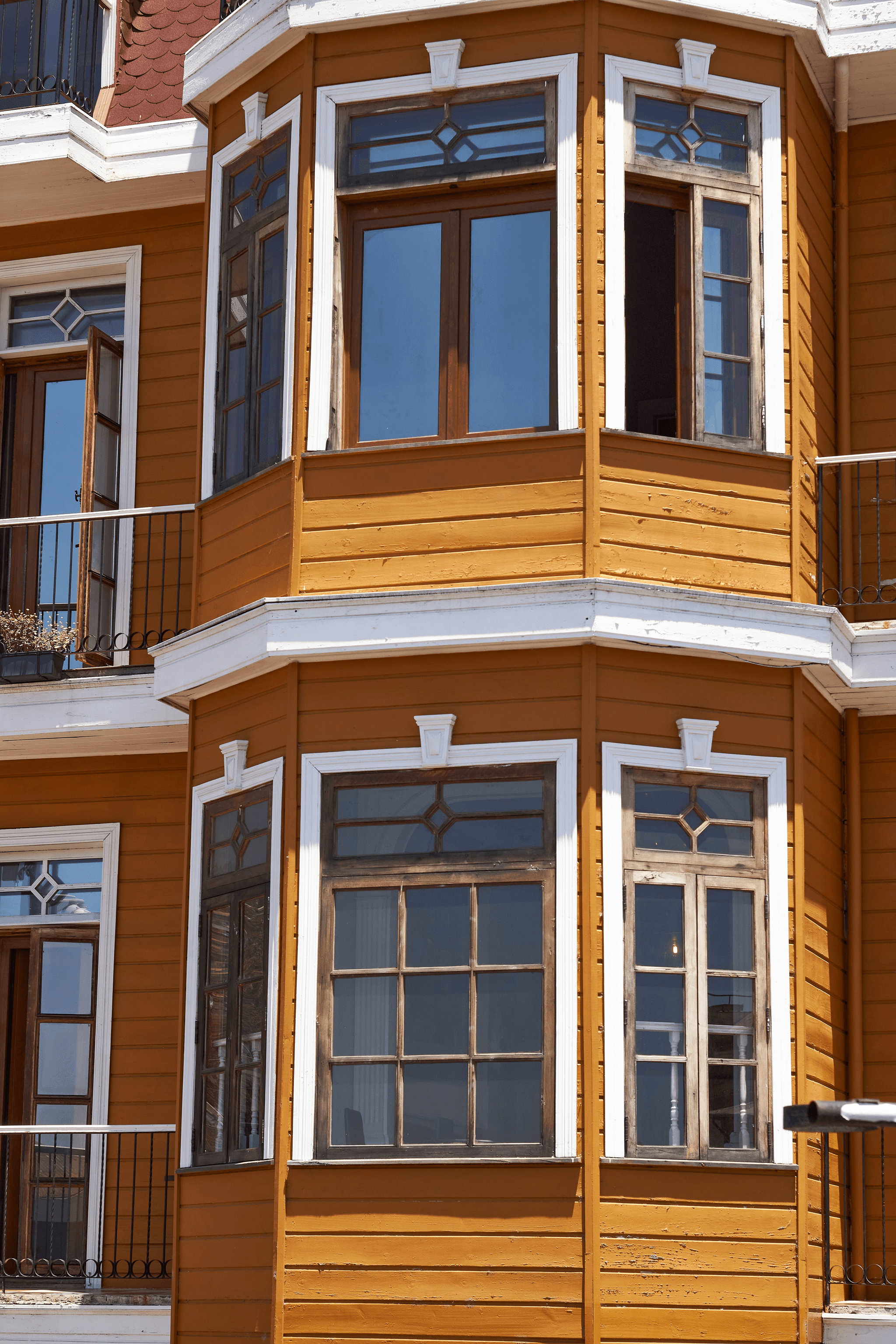 Different types of bay windows showcased in various home designs